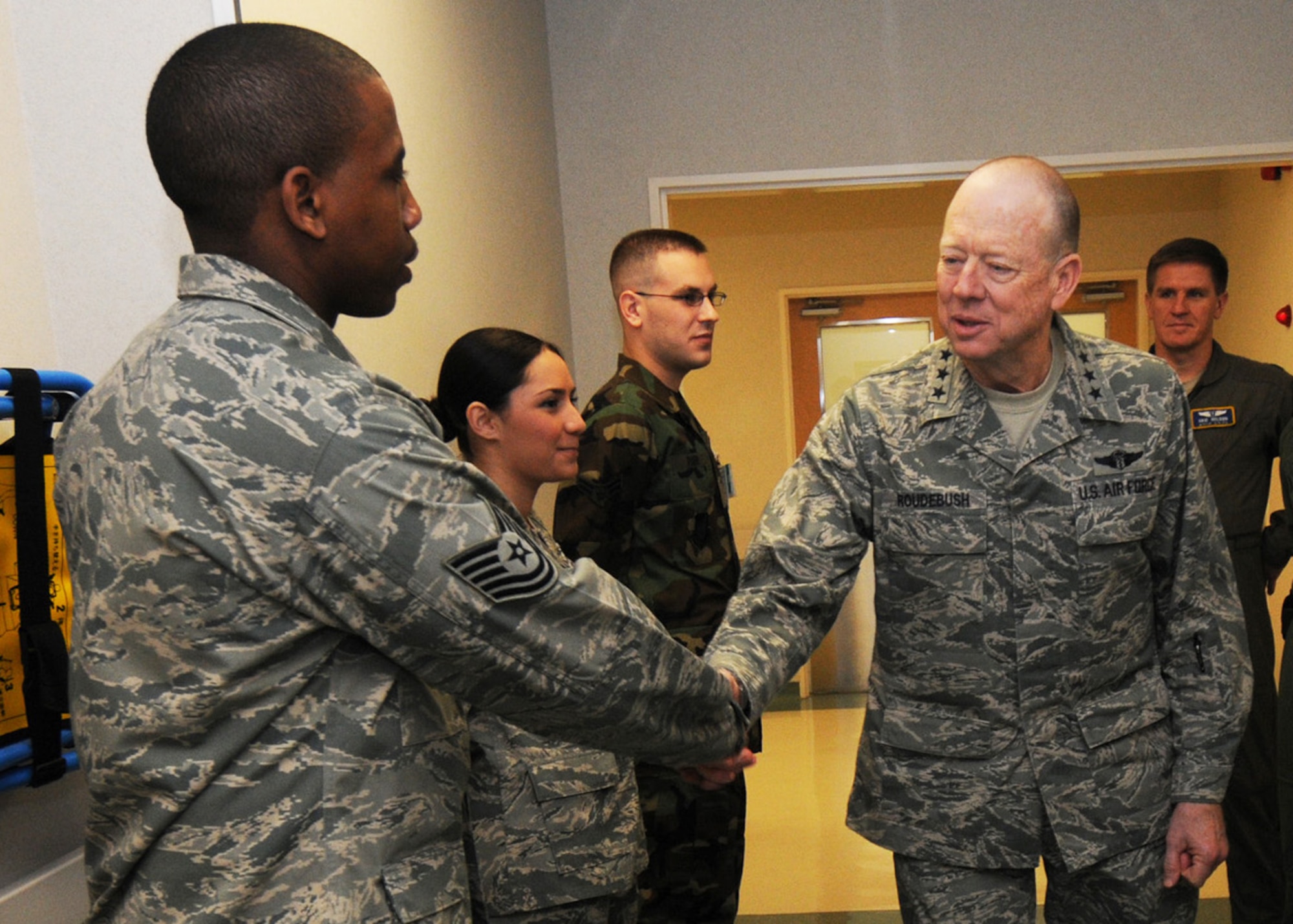 YOKOTA AIR BASE, Japan -- Air Force Surgeon General Lt. Gen. (Dr.) James G. Roudebush meets and greets Airmen form the 374th Medical Group here, Dec. 15. General Roudebush stopped at various Pacific Air Forces bases to visit with medical Airmen. (U.S. Air Force photo/ Senior Airman Veronica Pierce)
