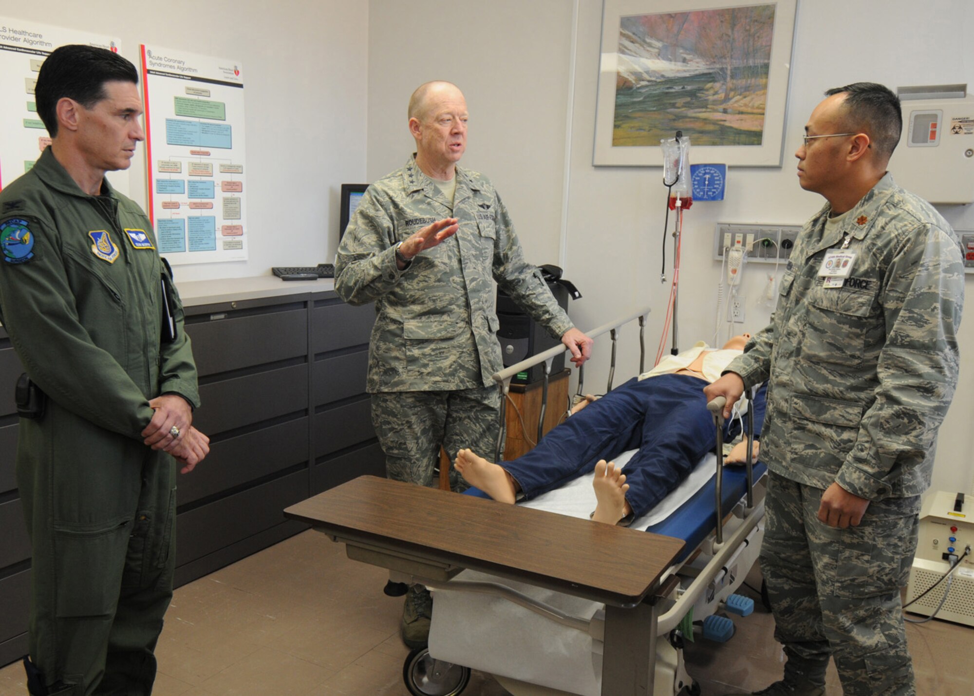 YOKOTA AIR BASE, Japan -- Air Force Surgeon General Lt. Gen. (Dr.) James G. Roudebush and Pacific Air Forces Surgeon General Col. (Dr.) Sean Murphy visit Airmen at the 374th Medical Group here, Dec. 15. Maj. Stephen Sapiera, 374 MDG education and training flight commander, briefs the surgeon generals on simulators used for training medical personnel. (U.S. Air Force photo/ Senior Airman Veronica Pierce)
