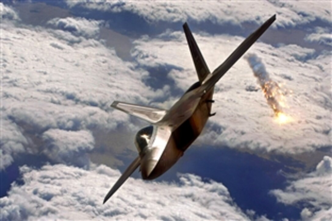 A U.S. Air Force F-22 Raptor shoots out a flare during an air-combat training mission over Japan, Jan. 15, 2009. The F-22 is deployed to Kadena Air Base, Japan, from the 27th Fighter Squadron on Langley Air Force Base, Va., in support of U.S. Pacific Command.