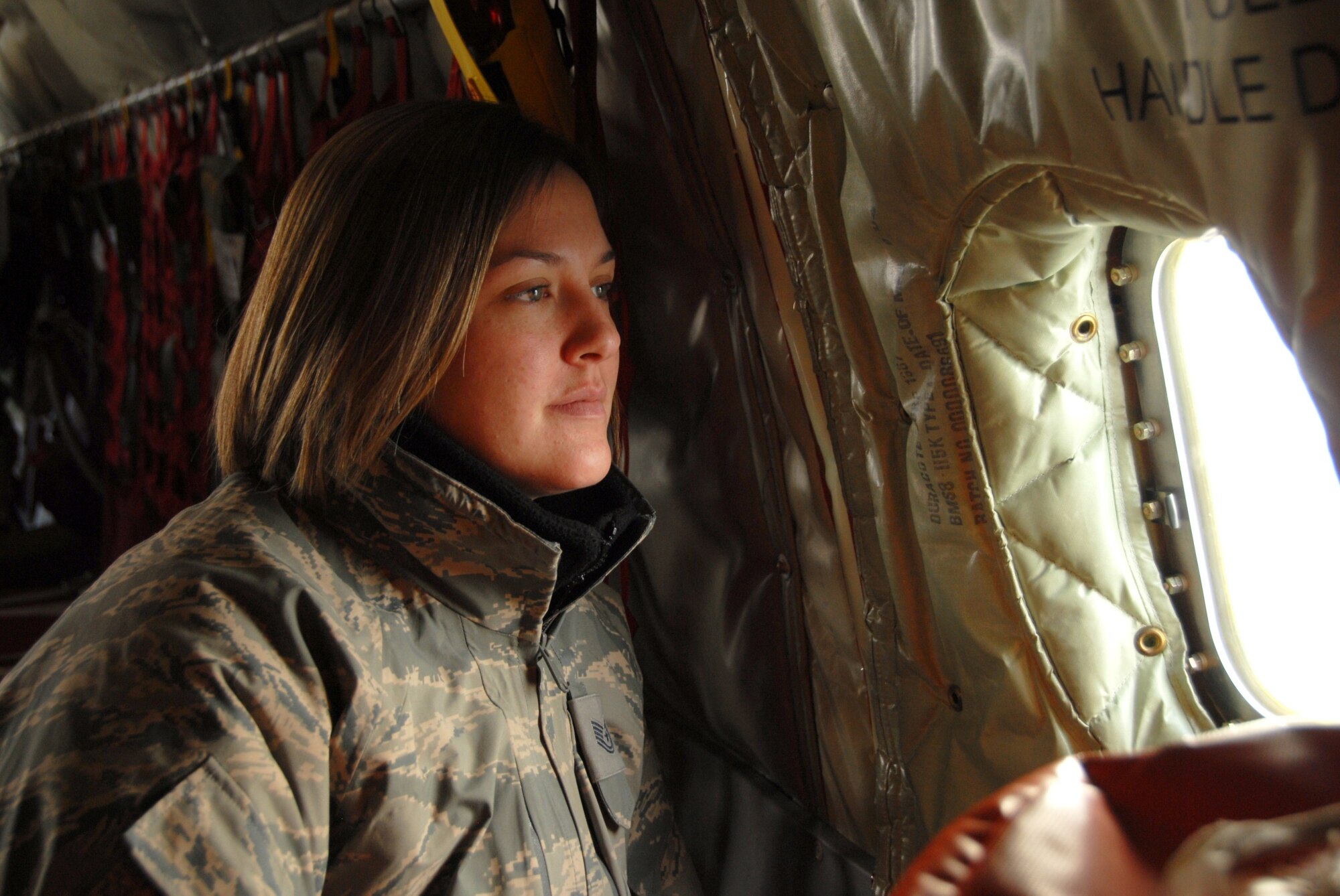 Technical Sergeant  (TSgt) Noelle Jacobs of the 185th Air Refueling Wing, Sioux City, Iowa, looks out over Washington, D.C. prior to landing at Andrews Air Force Base on 16 January, 2009.  TSgt. Jacobs is supporting Iowa National Guard Troops as the alternate Prime Readiness in Base (RIB) services manager during the inauguration of President-Elect Barack Obama.  (U.S. Air Force photo by TSgt. Brian Cox) (Released by MSgt Vincent DeGroot, Public Affairs Manager)