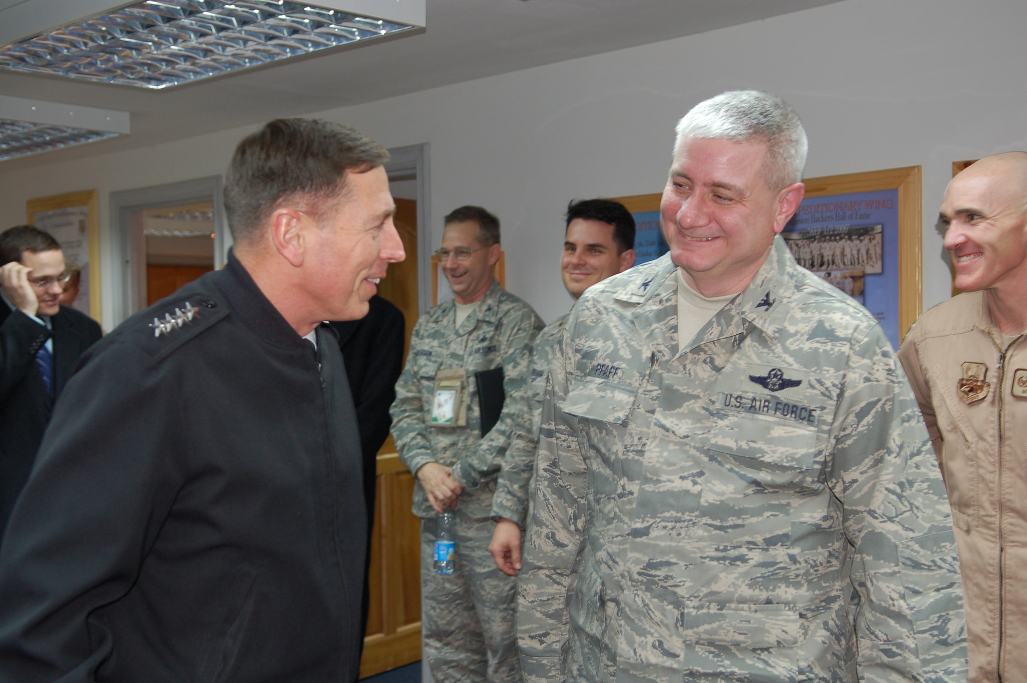 General David Petraeus, U.S. Central Command commander, talks with Col. James Pfaff, 376th Air Expeditionary Wing vice commander following a mission briefing at Manas Air Base, Kyrgyzstan, Jan. 17. The general's visit to the base kicked off a several day tour of the Central Asian country, his first since becoming the CENTCOM commander in October 2008. Manas AB serves as the premiere air mobility and refueling hub for operations in Afghanistan. (Photo by Maj. Damien Pickart) 