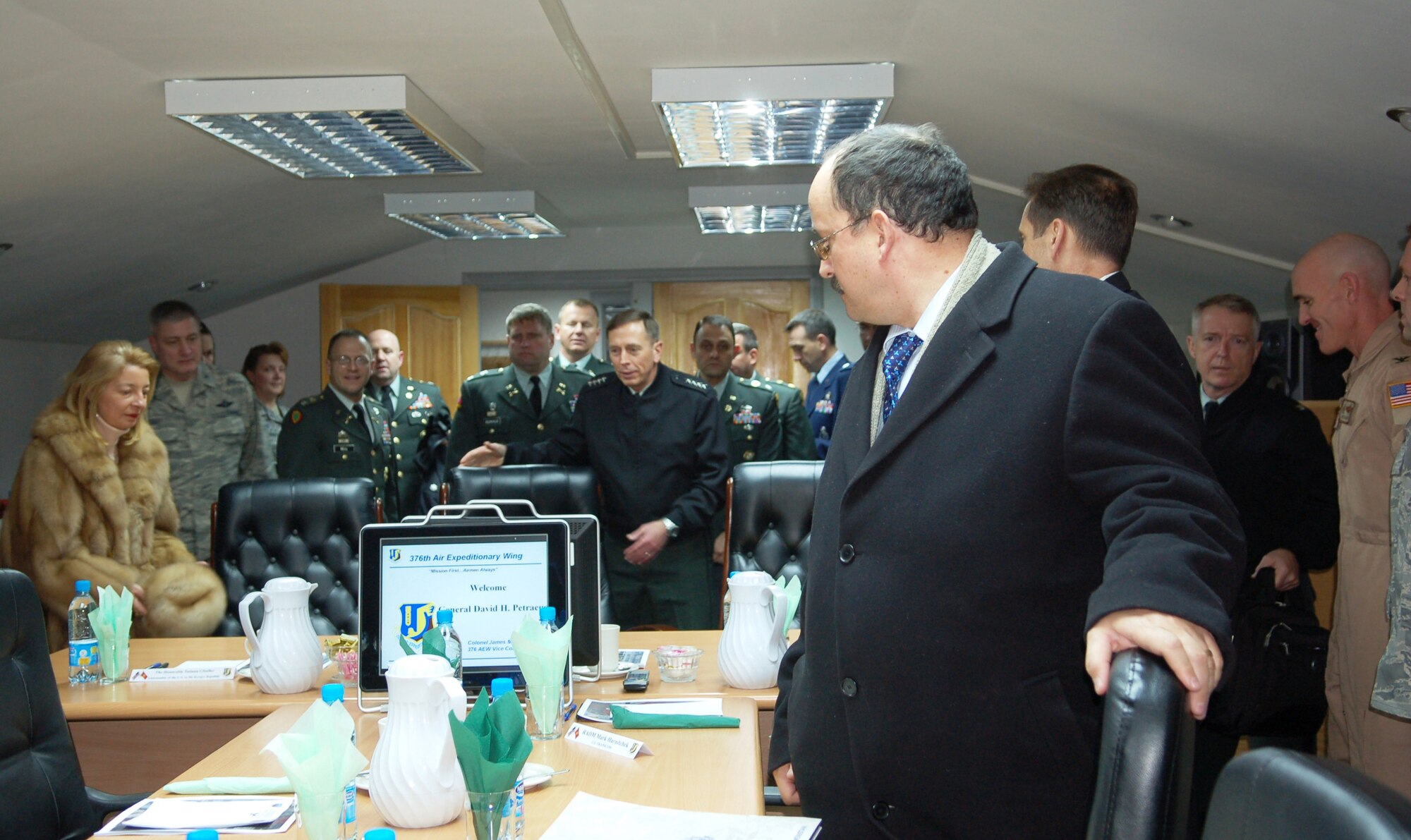 General David Petraeus, U.S. Central Command commander, U.S. Ambassador to Kyrgyzstan Tatiana Gfoeller (left) and members of CENTCOM leadership prepare to receive a mission briefing at Manas Air Base, Kyrgyzstan, Jan. 17. The general made his first visit to the 376th Air Expeditionary Wing since becoming the CENTCOM commander in October 2008. His base visit kicked off a several day visit to the Central Asian country. Manas AB serves as the premiere air mobility and aerial refueling hub for operations in Afghanistan. (Photo by Maj. Damien Pickart) 