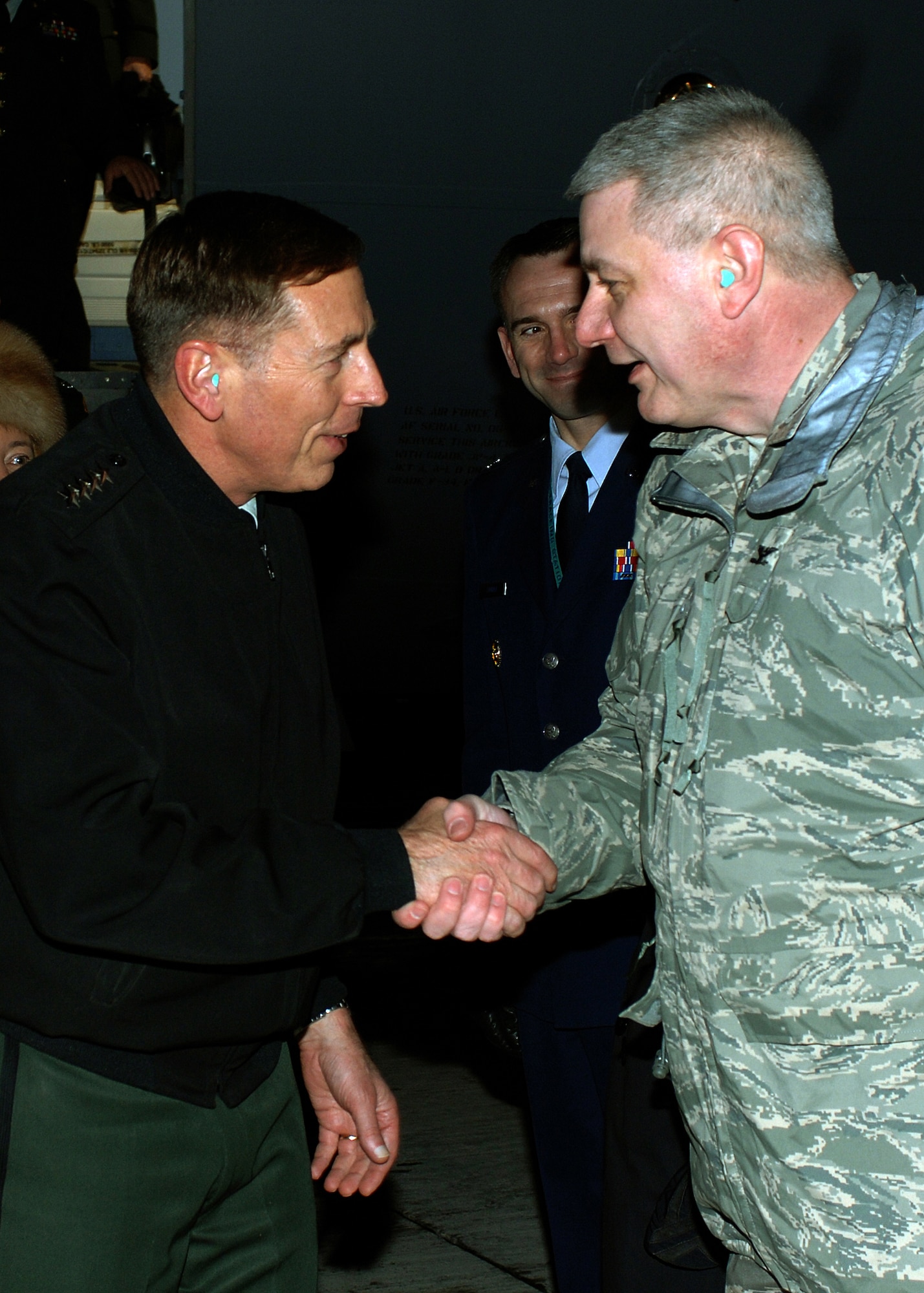 General David Petraeus, U.S. Central Command commander, arrives at Manas Air Base, Kyrgyzstan, Jan. 17, and is greeted by Col. James M. Pfaff, 376th Air Expeditionary Wing vice commander. The general made his first visit to the 376th AEW since becoming the CENTCOM commander in October 2008. His stop at Manas kicked off a several day visit to the Central Asian country. Manas AB serves as the premiere air mobility and air refueling hub for operations in Afghanistan. (U.S. Air Force photo/Tech. Sgt. Elizabeth Weinberg)