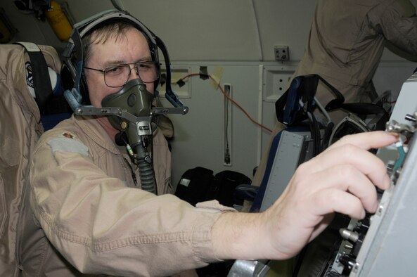 SOUTHWEST ASIA -- Maj. Jon Williams, 963rd Expeditionary Airborne Air Control Squadron, mission crew commander, adjusts his oxygen level during pre-flight checks, Jan. 15. Major Williams reached a milestone of flying hours as an air battle manager on an E-3 Sentry with a year's worth of hours (8,760 hours). Major Williams is from Edmond, Okla. and his home station is Tinker Air Force Base, Okla. (U.S. Air Force photo by Senior Airman Brian J. Ellis) (Released)