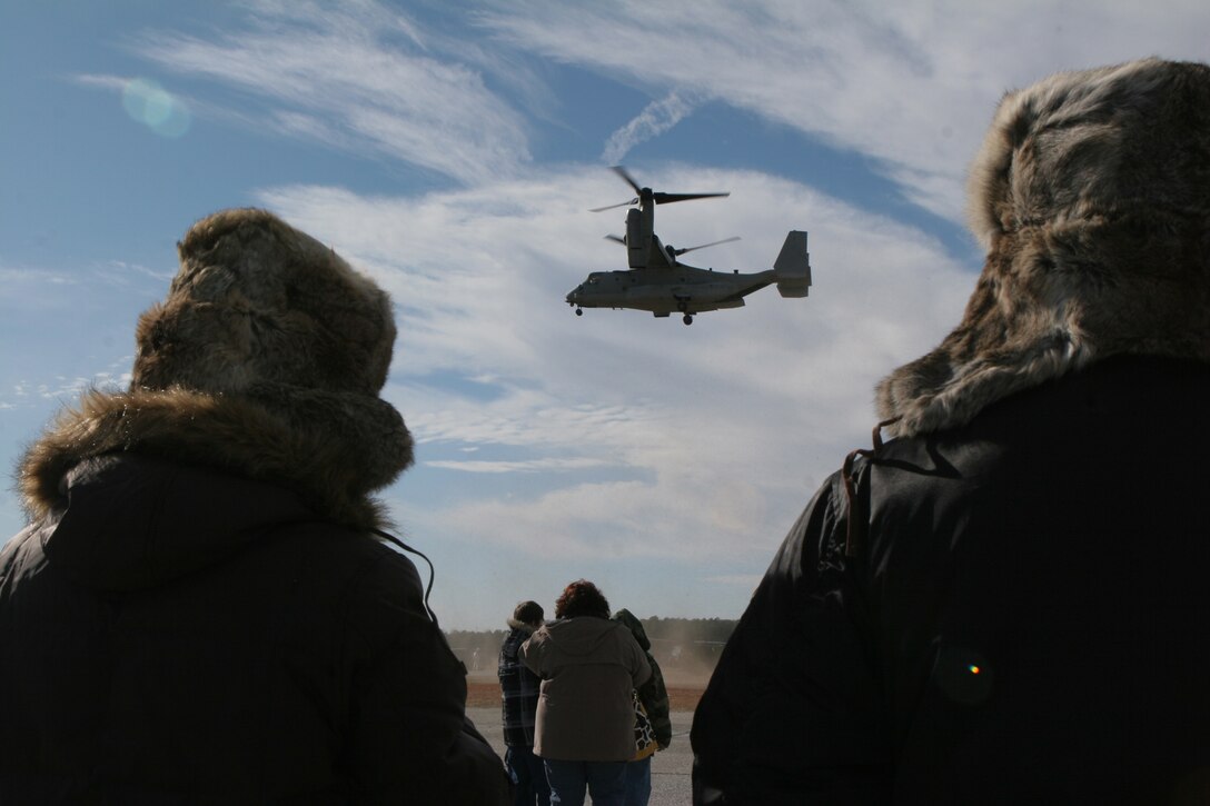 Local citizens of Virginia watch an MV-22B Osprey from Marine Medium Tiltrotor Squadron 263 (Reinforced), 22nd Marine Expeditionary Unit, Jan. 17, 2009, during Community Outreach Day aboard Fort Pickett, Va. The event was designed to allow Virginians a chance to get an up-close look at the MEU's Marines and equipment. (Official Marine Corps photo by Cpl. Alicia R. Giron) ::r::::n::