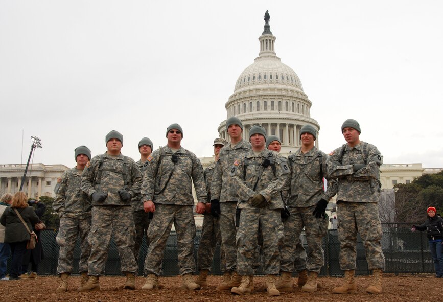 Members of Alpha Company, 1st Battalion, 168th Infantry Regiment, 34th Infantry Division, from Storm Lake, Iowa, momentarily pause during area reconnaissance in preparation for the up coming inauguration on 18 January, 2009.  Alpha Company is assisting federal, state, and local agencies with support missions for the inauguration of President-elect Barack Obama.   (US Air Force Photo by TSgt Brian Cox)(Released by MSgt Vincent DeGroot, Public Affairs Manager)