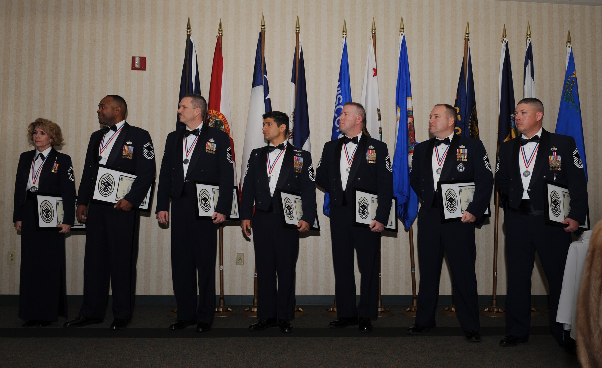 MOODY AIR FORCE BASE, Ga. -- Seven of the eight Moody members selected for promotion to the rank of chief master sergeant listen to Col. Kenneth Todorov, 23rd Wing commander, give his closing remarks at the Chief Recognition Ceremony here Jan. 17. The recognition ceremony is one of the oldest military traditions to help recognize a promotion in rank. (U.S. Air Force photo by Senior Airman Gina Chiaverotti)