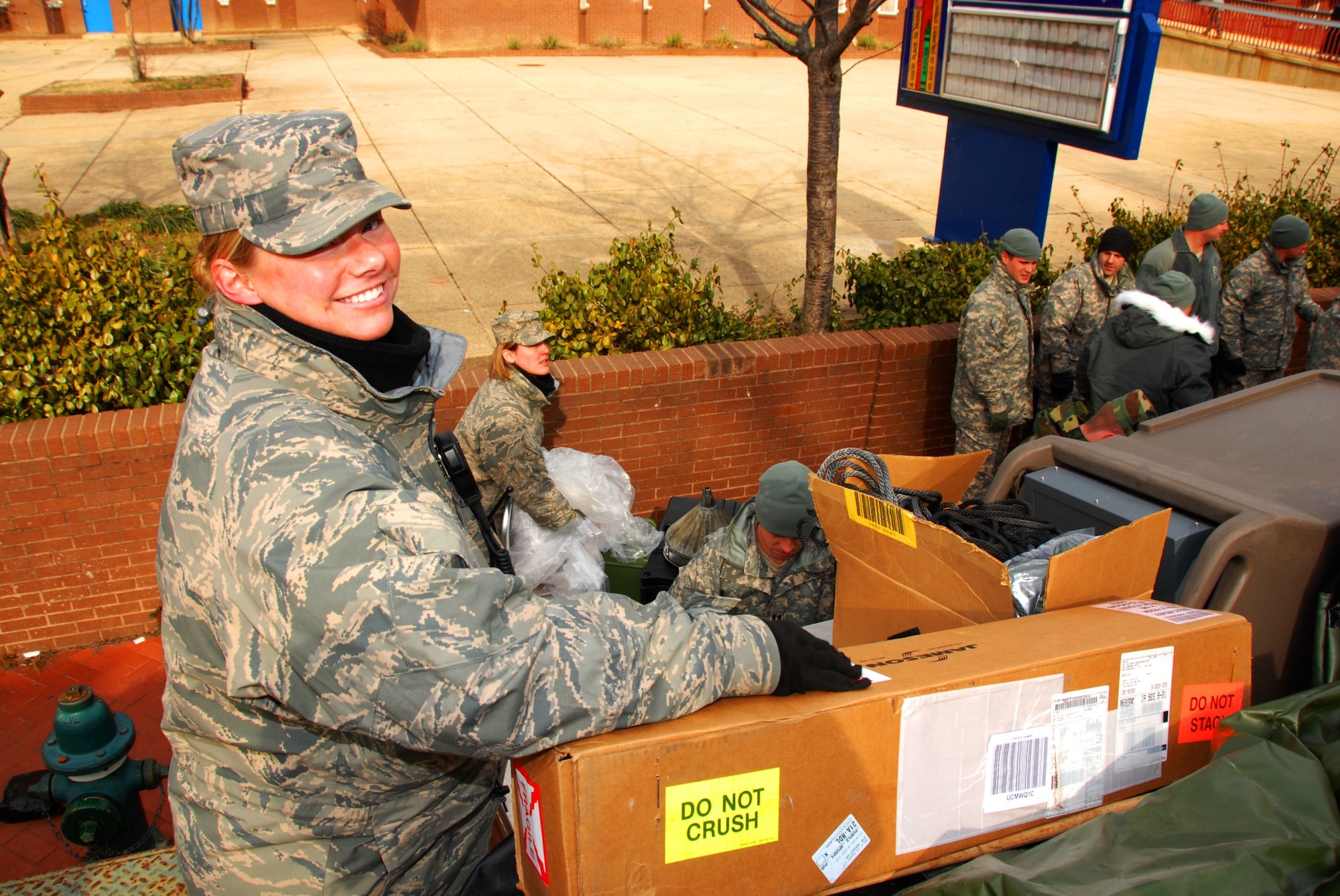 Technical Sergeant (SSgt) Trisha Theisen, Servises Flight Non Commisioned Officer In Charge, of the 185th Air Refueling Wing, Sioux City, Iowa, supervises the unloading of kitchen equipment on 17 January, 2009.  TSgt Theisen is supporting Iowa Army National Guard during the inauguration of President-elect Barack Obama.   (US Air Force Photo by TSgt Brian Cox)(Released by MSgt Vinvent DeGroot, Public Affairs Manage