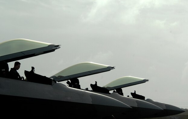 An F-22 Raptor pilot from Elmendorf Air Force Base, Alaska climbs out of the jet at Andersen Air Force Base Guam on Jan. 18. Andersen received 12 of the $140 million dollar aircraft, and more than 250 Airmen have already arrived at the base to begin a three month deployment as the Pacific's Theater Security Package.  As part of the continuing force posture adjustments to address worldwide requirements, the United States continues to deploy additional forces like the F-22 throughout the Western Pacific. This is the latest example of the flexibility U.S. forces have to meet their ongoing commitments and security obligations throughout the Pacific region. 

(U.S. Air Force photo/ Master Sgt. Kevin J. Gruenwald) released





















  












 











































  












 

























