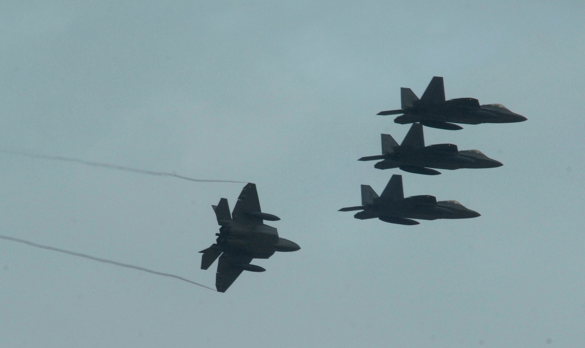 F-22 Raptors deployed from Elmendorf Air Force Base, Alaska, prepare to land at Andersen Air Force Base, Guam, Jan. 18, Andersen received 12 of the $140 million dollar aircraft, and more than 250 Airmen have already arrived at the base to begin a three month deployment as the Pacific's Theater Security Package. The stealth-fighters, along with associated maintenance and support personnel, are deployed as the 90th Expeditionary Fighter Squadron and will participate in various exercises that provide routine training in an environment different from their home station. 

(U.S. Air Force photo/ Master Sgt. Kevin J. Gruenwald) released





















  












 











































  












 

























