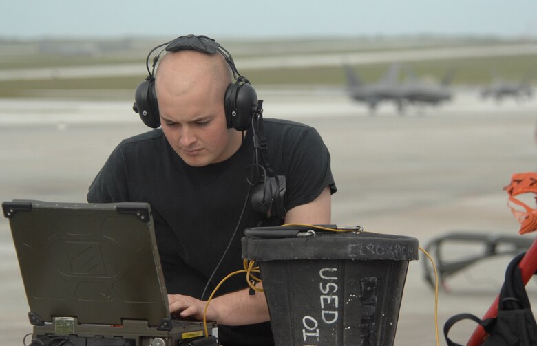 Airman 1st Class Bryon Harrington reviews aircraft data as the F-22 Raptors deployed from Elmendorf Air Force Base, Alaska, arrive at Andersen Air Force Base, Guam, Jan. 18. Andersen received 12 of the $140 million dollar aircraft, and more than 250 Airmen have already arrived at the base to begin a three month deployment as the Pacific's Theater Security Package.  As part of the continuing force posture adjustments to address worldwide requirements, the United States continues to deploy additional forces like the F-22 throughout the Western Pacific. This is the latest example of the flexibility U.S. forces have to meet their ongoing commitments and security obligations throughout the Pacific region. Airman Blahut is an avionics specialist, 90th Fighter Squadron, Elmendorf AFB, Alaska.
(U.S. Air Force photo/ Master Sgt. Kevin J. Gruenwald) released





















  












 











































  












 

























