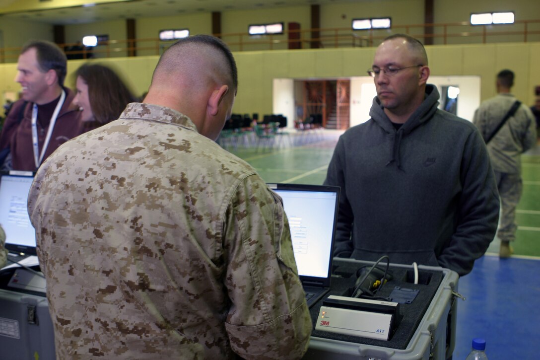 A Volunteer evacuee waits to be processed in by a Marine from Combat Logistics Battalion-26, 26th Marine Expeditionary Unit, during a Noncombatant Evacuation Operation conducted as part of a Joint Combined Security Exercise at the Chevron Station in Kuwait, Jan. 19, 2009. The 26th Marine Expeditionary Unit is currently deployed to the U.S. Central Command Area of Operation as part of its 2008-2009 deployment.