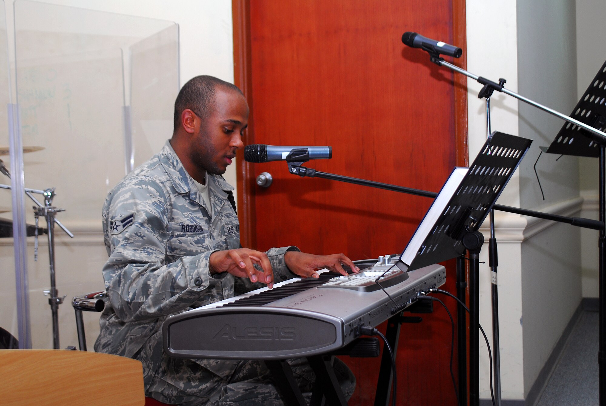 SOUTHWEST ASIA -- Airman 1st Class Breyson Robinson, 386th Expeditionary Force Support Squadron, plays the piano at the Martin Luther King celebration Jan. 19 at the Rock Chapel. (U.S. Air Force photo by Staff Sgt. Thomas J. Doscher)