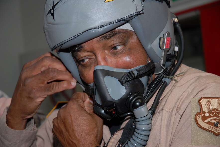 Col. (Ret.) Richard Toliver, a former F-15 test pilot and second generation Tuskegee Airman, gets fitted with a helmet and G-suit for an incentive flight in an F-15D Eagle at Kadena Air Base, Japan, Jan. 15, 2009. Col. Toliver later spoke to more than 400 people at the base's observance of Martin Luther King Jr. Day . (U.S. Air Force photo/Staff Sgt Angelique Perez)