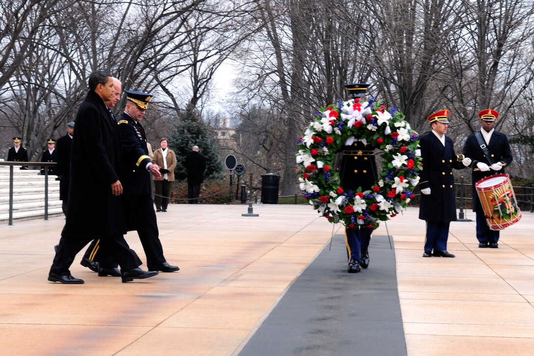 President-elect Barack Obama, Vice President-elect Joe Biden and Army Maj.
Gen. Richard Rowe, chairman of the Armed Forces Inaugural Committee, take part in a wreath-laying ceremony at the Tomb of the Unknowns in Arlington National Cemetery in Arlington, Va., Jan. 18, 2009.