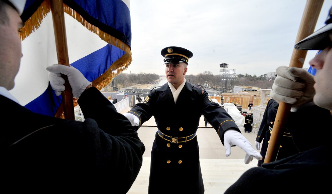 Army Staff Sgt. Adam Dickmyer of the 3rd U.S. Infantry Regiment, "The Old Guard," gives facing movement instructions to his soldiers before taking part in inaugural opening ceremonies at the Lincoln Memorial on the National Mall in Washington, D.C., Jan. 18, 2009.