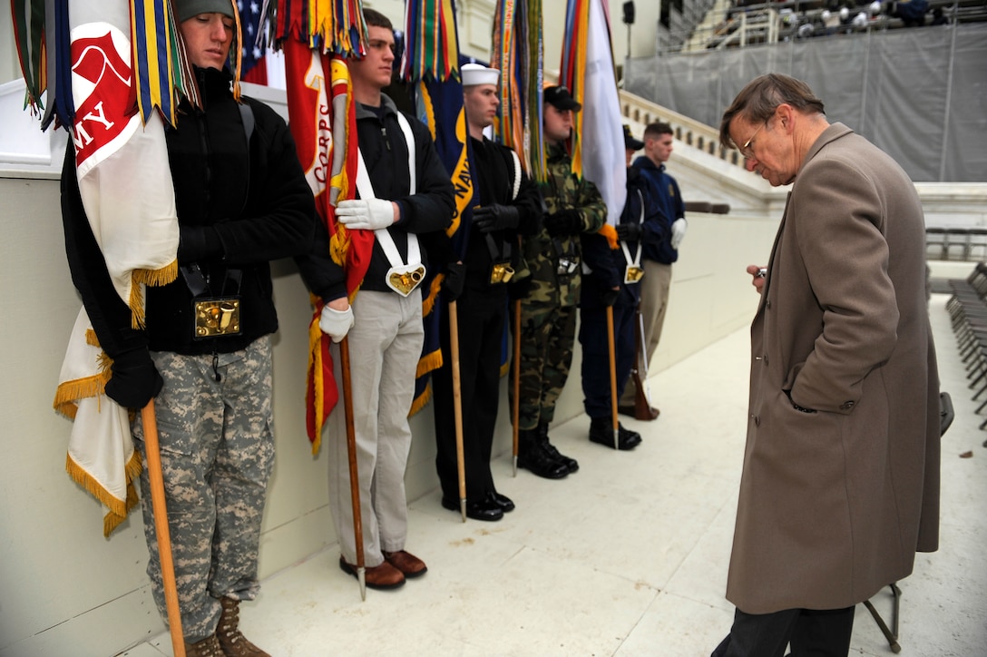 Thomas Groppel, head of the Armed Forces Inaugural Committee's Ceremonies Directorate, times the joint honor guard's movements during a rehearsal at the Capitol in Washington, D.C., Jan. 18, 2009.