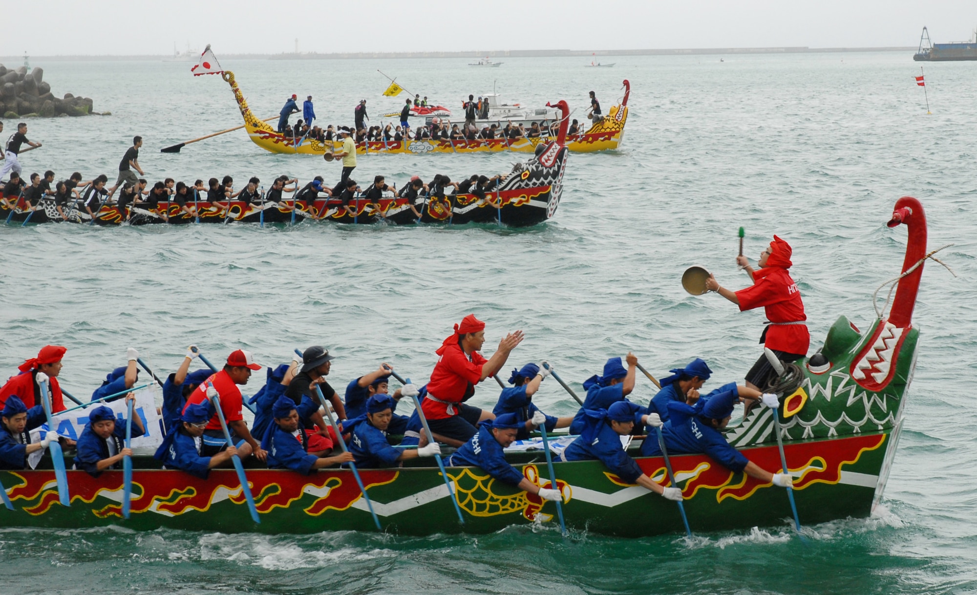Three teams battle for the lead during the Dragon Boat Race May 5, 2008 at Tomari Port. The race, which caps off the week-long series of Japanese holidays called Golden Week, has been held annually for centuries on Okinawa.
(U.S. Air Force photo/Airman Chad Warren)