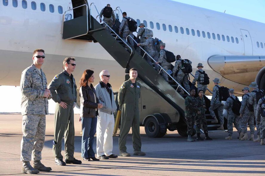 DYESS AIR FORCE BASE, Texas -- Members of the 7th Bomb Wing board a civilian contracted flight for deployment here, Jan. 20.  Approximately 300 of Dyess' Airmen will deploy in the next few weeks. (U.S. Air Force photo by Senior Airman Domonique Simmons)