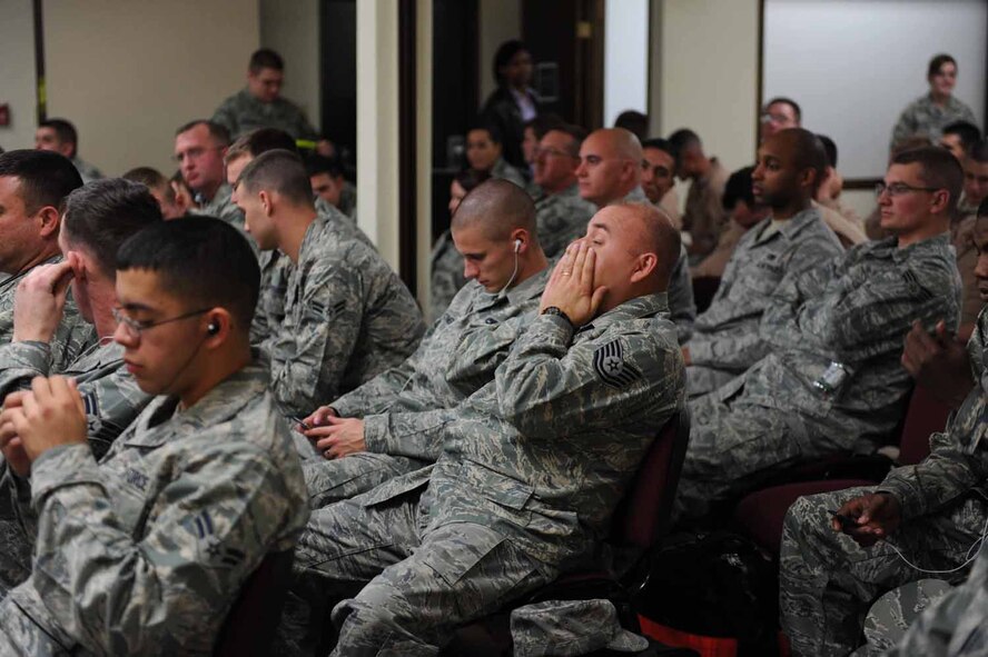 DYESS AIR FORCE BASE, Texas -- Members of the 7th Maintenance Group are in a holding room waiting for their flight here, Jan. 20.  Working personnel keep accountability by holding the identification cards of any one leaving the holding area. (U.S. Air Force photo by Senior Airman Domonique Simmons)