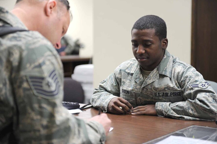 DYESS AIR FORCE BASE, Texas -- Airman 1st Class Ralph Dixon, from the 7th Logistics Readiness Squadron, supervises and manages deploying personnel's information here, Jan. 20. Recording the combined weight of each person including their personal carry-on bags ensures the weight does not exceed the aircraft's maximum capacity. (U.S. Air Force photo by Senior Airman Domonique Simmons)