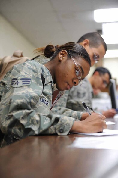 DYESS AIR FORCE BASE, Texas -- Senior Airman Britney Walker, from the 9th Bomb Squadron, processes through the personnel deployment function line here, Jan. 20. Airman Walker is one of the deployers processing for the mass deployment. (U.S. Air Force photo by Senior Airman Domonique Simmons)