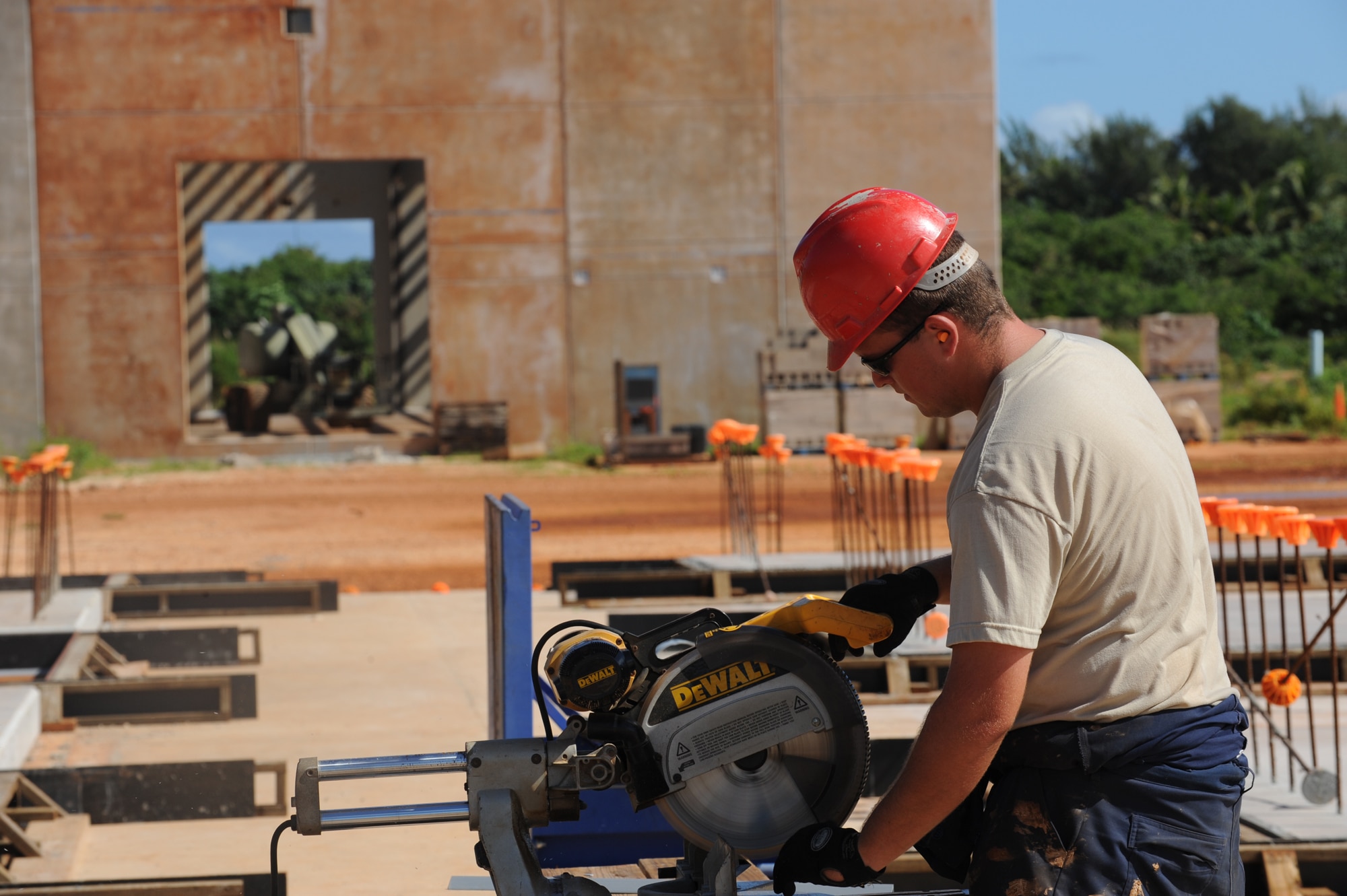 Staff. Sgt. Brandon Hall cuts rebar to reinforce concrete Jan.13 at Northwest field, Andersen Air Force Base, Guam. The 10-year construction plan will provide 80 facilities and infrastructure supporting four units: 554th and 254th RED HORSE Squadrons, Commando Warrior, 644th Combat Communications and 554th Silver Flag onto one base. Once complete, the state-of-the-art training site will be instrumental in the continuing effort in supporting the Global War on Terrorism. Sgt. Hall is assigned to the 554th Red Horse Squadron at Andersen.
(U.S. Air Force photo/ Master Sgt. Kevin J. Gruenwald) 