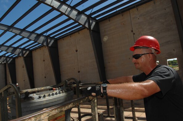 Staff Sgt. Degeo Schultz operates hoist equipment Jan. 13 at Northwest field, Andersen Air Force Base, Guam. The 10-year construction plan will provide 80 facilities and infrastructure supporting four units: 554th and 254th RED HORSE Squadrons, Commando Warrior, 644th Combat Communications and 554th Silver Flag onto one base, instead of being spread across Pacific Command. Sergeant Schultz is assigned to the 554th Red Horse Squadron at Andersen.
(U.S. Air Force photo/ Master Sgt. Kevin J. Gruenwald) 