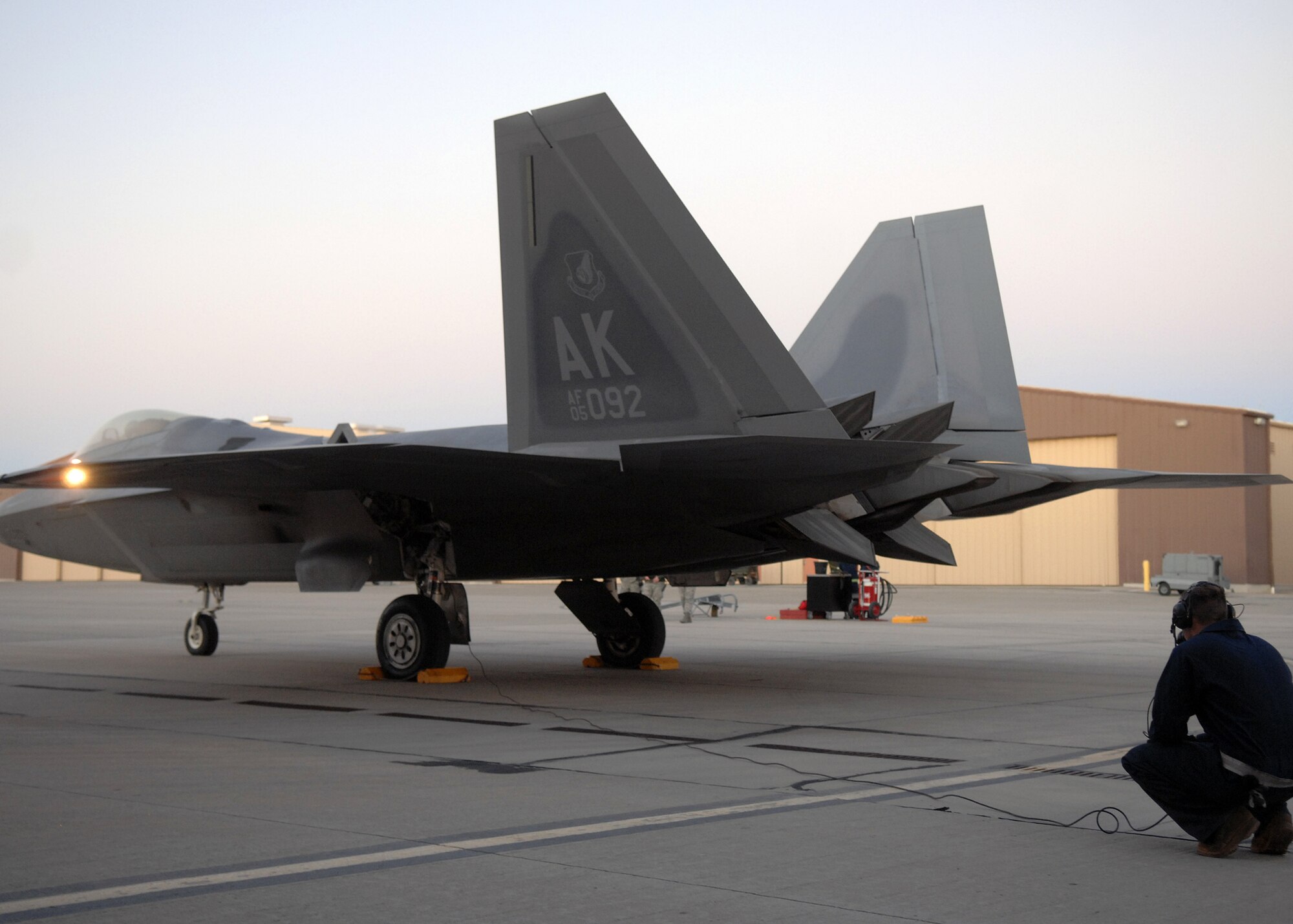 Senior Airman Kyle Serrates, 49th Aircraft Maintenance Squadron, assistant dedicated crew chief, awaits an F-22A Raptor take off, Jan.15, at Holloman Air Force Base, N.M. Airmen and pilots gear up for their upcoming exercise "Red Flag" at Nellis AFB, Nevada, starting around the end of January. The Red Flag exercises, conducted in four to six times a year by the 414th Combat Training Squadron of the 57th Wing, are very realistic aerial war games. The purpose is to train pilots from the U.S., NATO (North Atlantic Treaty Organization) and other allied countries for real combat situations. This includes the use of "enemy" hardware and live ammunition for bombing exercises within the Nevada Test and Training Range.


(U.S. Air Force photo/ Senior Airman Anthony Nelson Jr)
