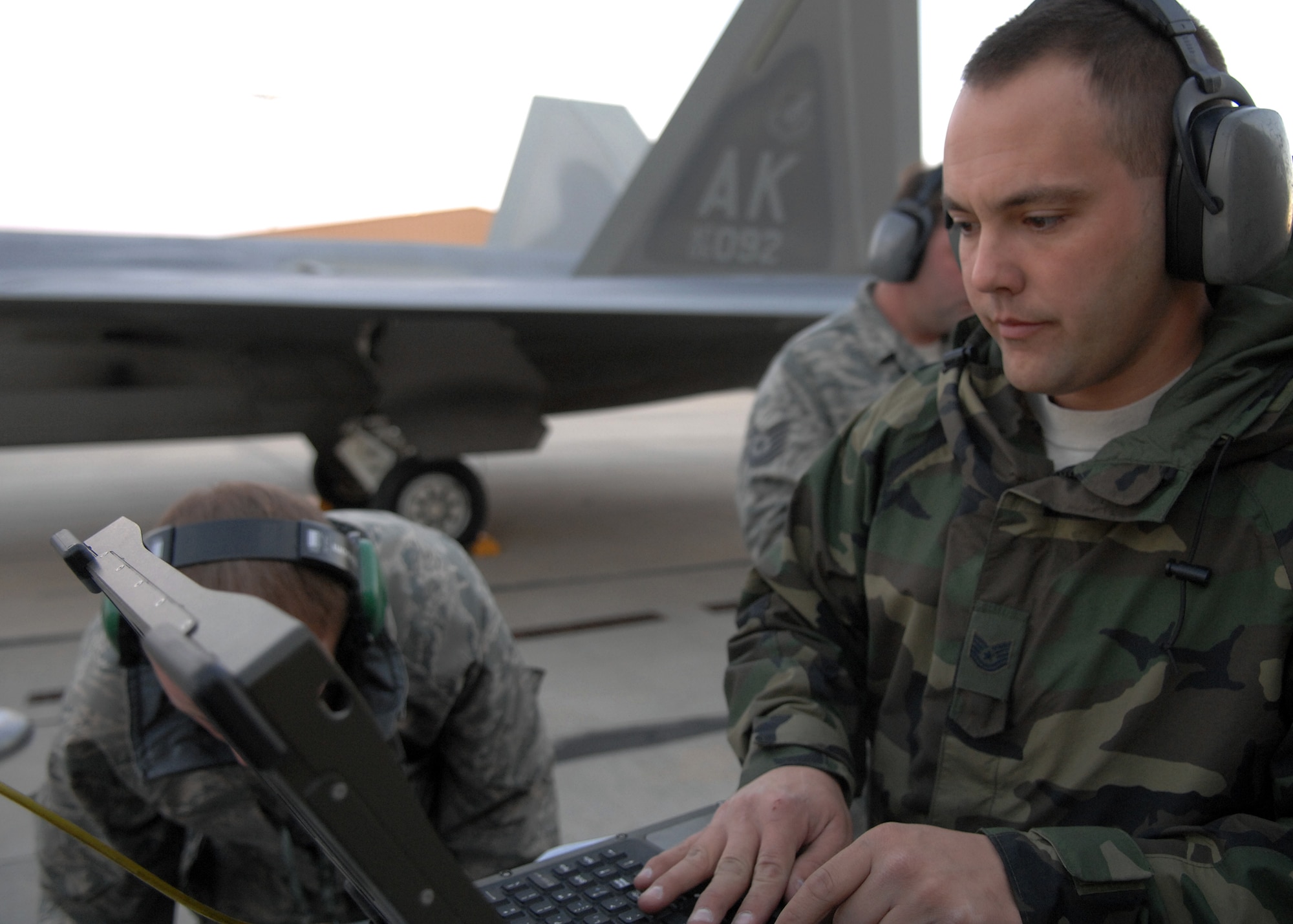 Tech. Sgt. Aaron Cowan, 49th Aircraft Maintanence Squadron, works on forms for the F-22A Raptor by using a Portable Maintenace Aid, Jan. 15, at Holloman Air Force Base, N.M. Airmen and pilots gear up for their training exercise Red Flag at Nellis AFB, N.V., beginning the end of January. The Red Flag exercises, conducted in four-to-six cycles a year by the 414th Combat Training Squadron of the 57th Wing, are very realistic aerial war games. The purpose is to train pilots from the U.S., NATO (North Atlantic Treaty Organization) and other allied countries for real combat situations. This includes the use of "enemy" hardware and live ammunition for bombing exercises within the Nevada Test and Training Range.


(U.S. Air Force photo/ Senior Airman Anthony Nelson)
