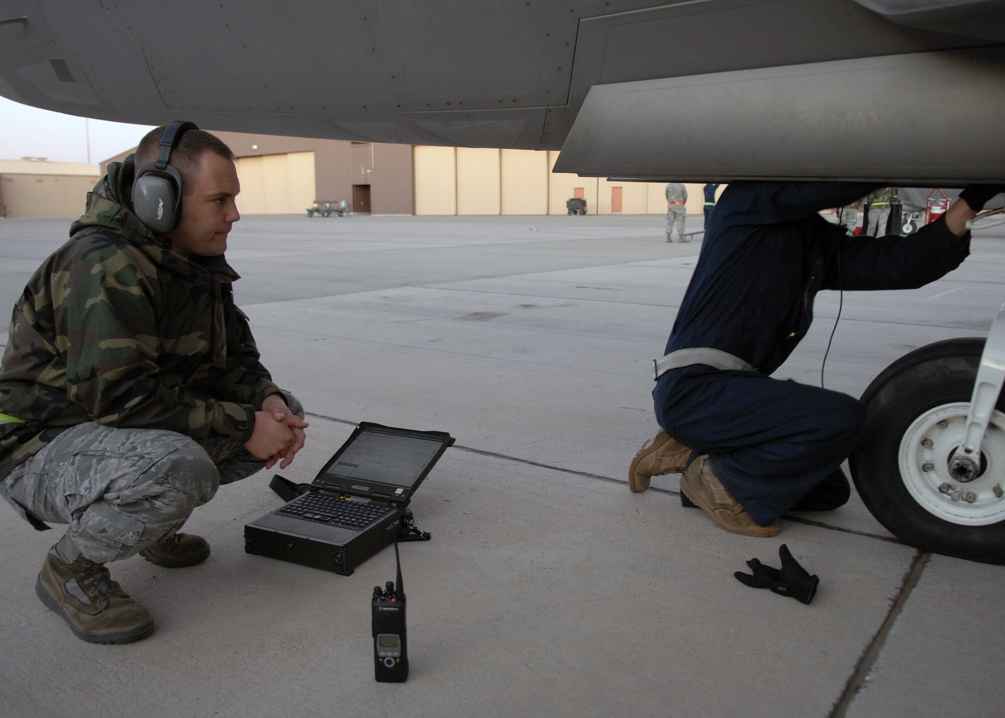 Tech. Sgt. Stephen Polk assist Senior Airman Kyle Serrates, 49th Aircraft Maintenance Squadron, in working on an F-22A Raptor, Jan. 15, at Holloman Air Force Base, N.M. Airmen and pilots gear up for their upcoming exercise Red Flag at Nellis AFB, N.V., beginning the end of January. The Red Flag exercises, conducted in four to six times a year by the 414th Combat Training Squadron of the 57th Wing, are very realistic aerial war games. The purpose is to train pilots from the U.S., NATO and other allied countries for real combat situations. This includes the use of "enemy" hardware and live ammunition for bombing exercises within the Nevada Test and Training Range.




(U.S. Air Force photo/ Senior Airman Anthony Nelson Jr)

