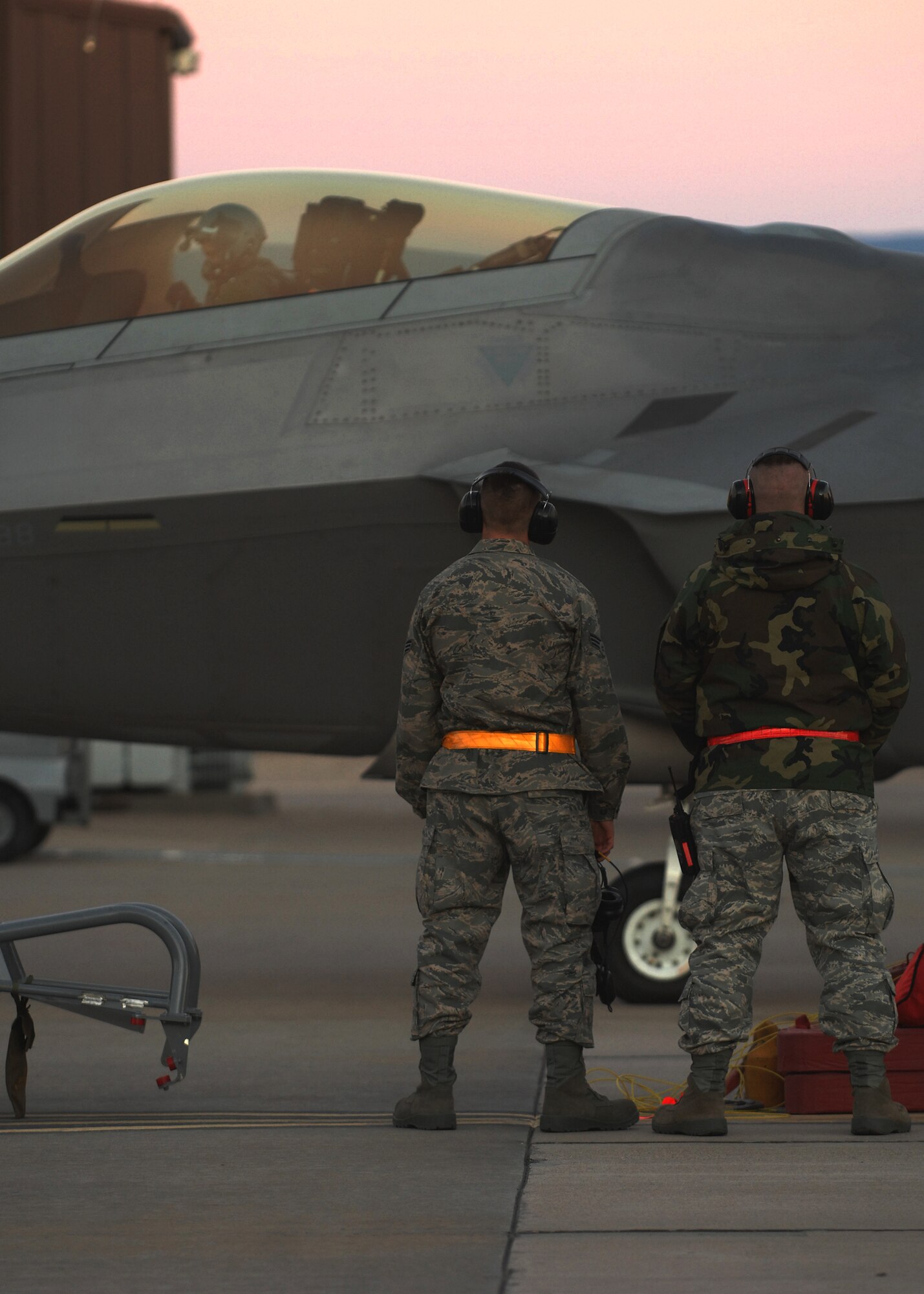 (Left to right) Staff Sergeants Michael Smith and Chris Tillery, 49th Aircraft Maintenance Squadron, work on an F-22A Raptor, Jan 15, at Holloman Air Force Base, N.M. Airmen and pilots gear up for their training exercise "Red Flag" at Nellis AFB, Nevada, starting around the end of January The Red Flag exercises, conducted in four-to-six cycles a year by the 414th Combat Training Squadron of the 57th Wing, are very realistic aerial war games. The purpose is to train pilots from the U.S., NATO and other allied countries for real combat situations. This includes the use of "enemy" hardware and live ammunition for bombing exercises within the Nevada Test and Training Range.


(U.S. Air Force photo/ Senior Airman Anthony Nelson Jr)

