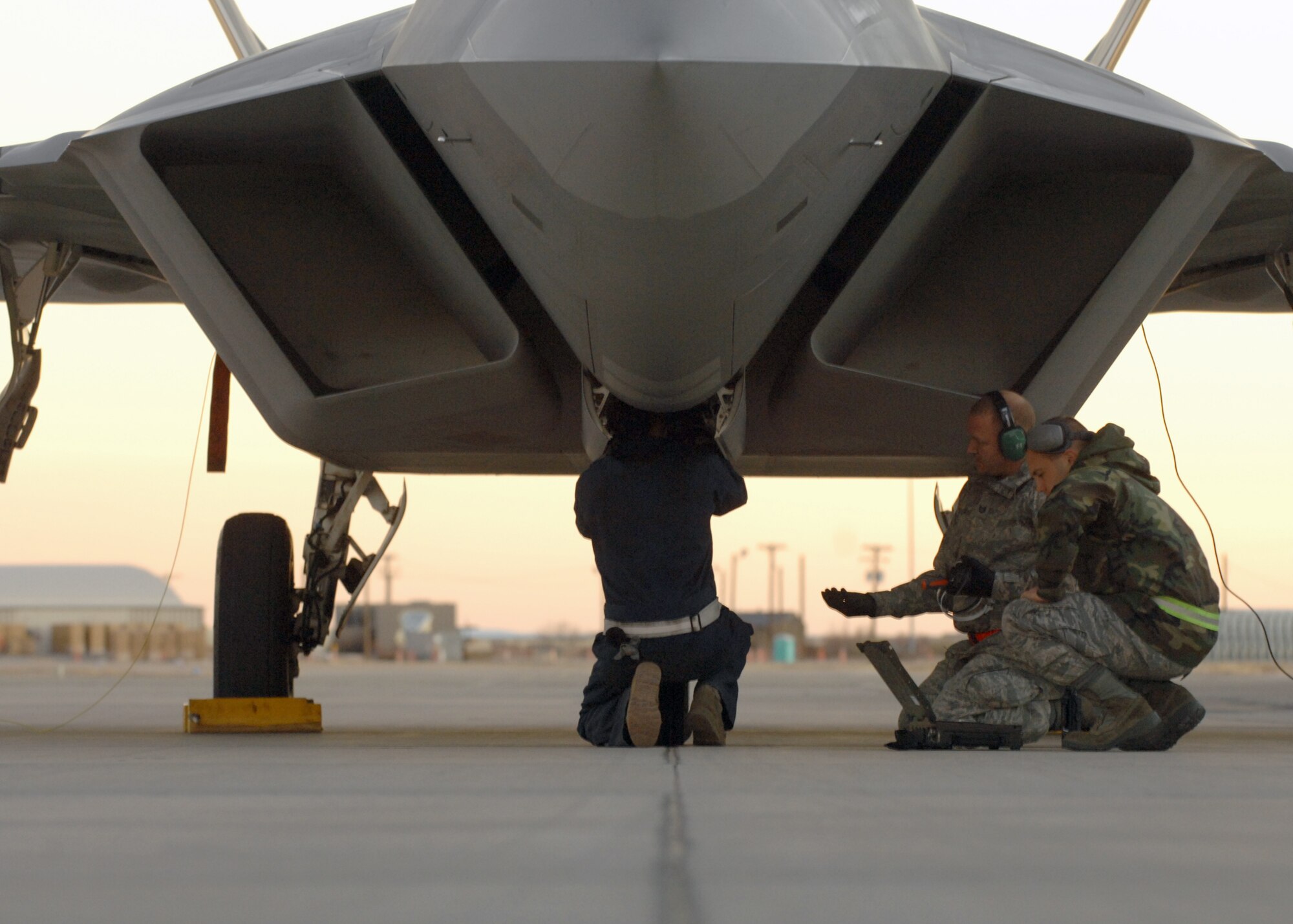 Airmen from the 49th Aircraft Maintenance Squadron work on an F-22A Raptor, Jan. 15, at Holloman Air Force Base, N.M. Airmen and pilots gear up for their training exercise "Red Flag" at Nellis AFB, Nevada, starting around the end of January. The Red Flag exercises, held periodically at the Nellis Air Force Base since 1975, are very realistic aerial war games. The purpose of Red Flag is to give pilots from the U.S., NATO (North Atlantic Treaty Organization) and other allied countries an opportunity to practice and refine their skills for real combat situations. This includes the use of "enemy" hardware and live ammunition for bombing exercises within the Nellis complex

(U.S. Air Force photo/ Senior Airman Anthony Nelson Jr)
