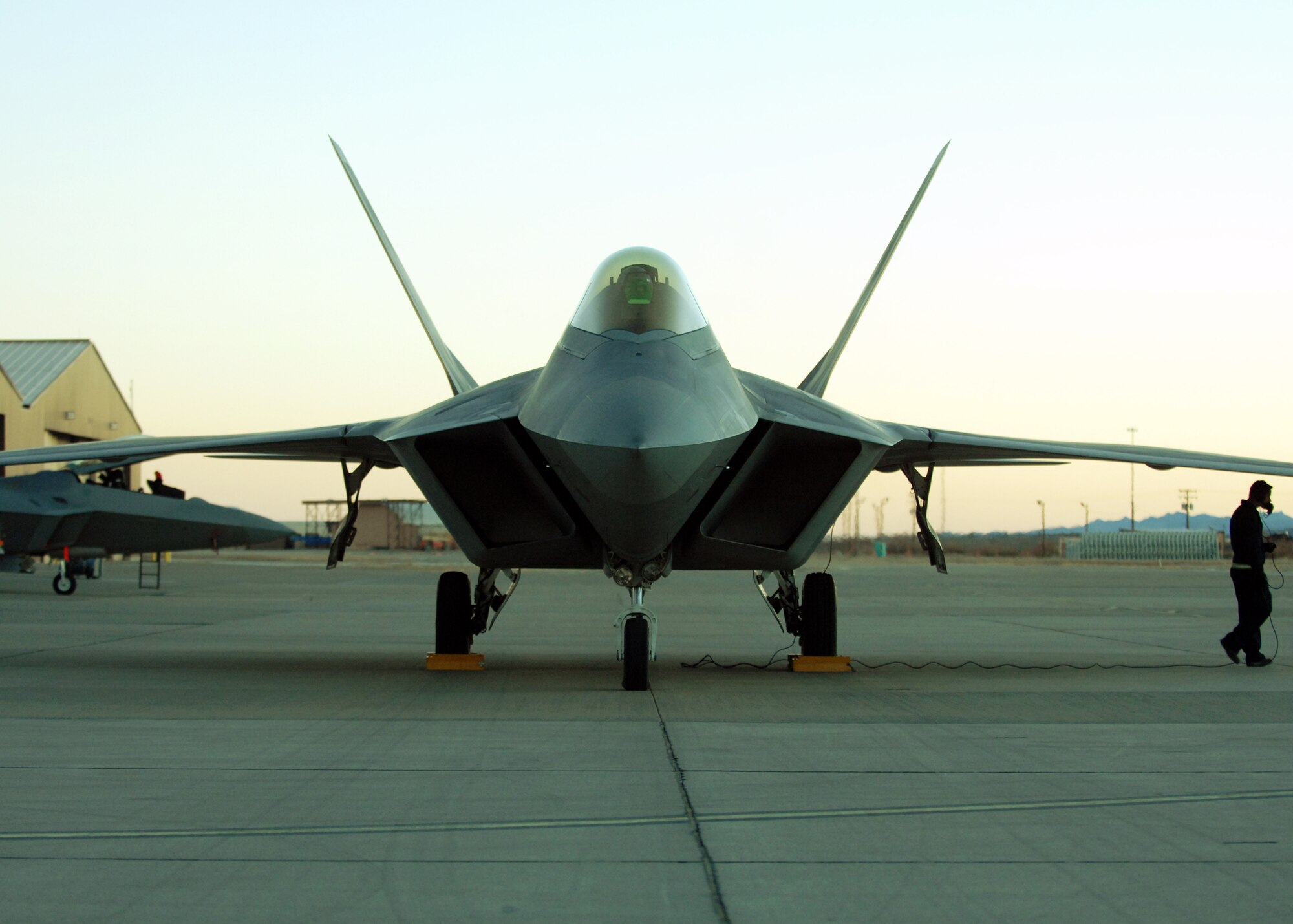 Airmen from the 49th Aircraft Maintenance Squadron work on an F-22A Raptor, Jan. 15, at Holloman Air Force Base, N.M. Airmen and pilots gear up for their training exercise "Red Flag" at Nellis AFB, Nevada, starting around the end of January. The Red Flag exercises, held periodically at the Nellis Air Force Base since 1975, are very realistic aerial war games. The purpose of Red Flag is to give pilots from the U.S., NATO (North Atlantic Treaty Organization) and other allied countries an opportunity to practice and refine their skills for real combat situations. This includes the use of "enemy" hardware and live ammunition for bombing exercises within the Nellis complex

(U.S. Air Force photo/ Senior Airman Anthony Nelson Jr)

