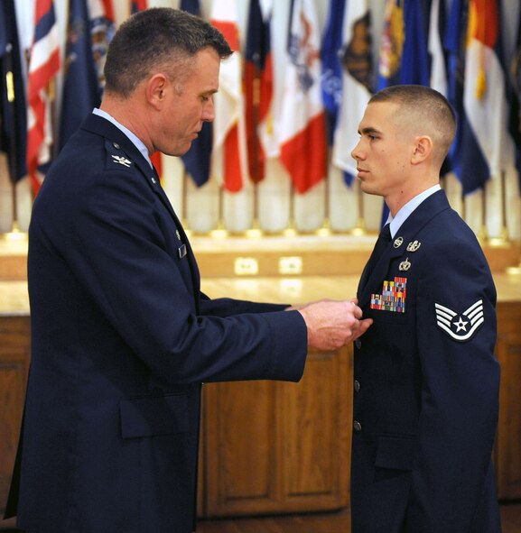 DYESS AIR FORCE BASE, Texas -- Staff Sgt.Ryan Oliver (right), 7th Civil Engineering Squadron, received the Bronze Star Medal from Colonel Robert Gass, 7th Bomb Wing commander, here, Jan 16.  Sergeant Oliver and Chief Master Sergeant Thomas Buchanan received the prestigious medal for distinguishing themselves by exceptionally meritorious conduct in support of Operation Iraqi Freedom. (U.S. Air Force photo Staff Sergeant Connor Estes).   