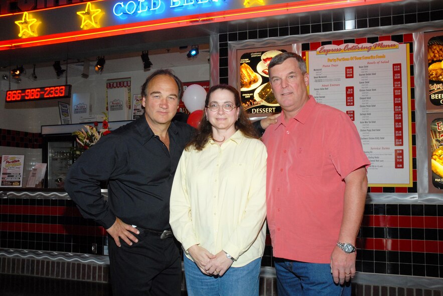 Entertainer Jim Belushi poses with Karen Petruskevich and Maj. Gen. Robert E. Duignan, Commander, Fourth Air Force, March ARB, Calif. at the Portillo's Restaurant opening last year.