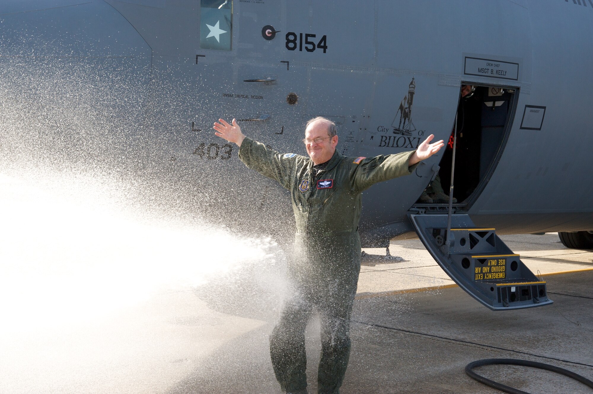 Brig. Gen Rich Moss gets "hosed down" after his final flight, Jan. 15.  Known as the "fini flight," the pilot is honored for the their service to the Air Force by being doused with water and receiving a congratulatory ceremony after the flight.  General Moss served nearly four decades for the Air Force Reserve and served as the 403rd Wing Command for more than 4 years.   General Moss relinquished command of the 403rd Wing to Colonel James J. Muscatell, Jr., Jan. 11.  (U.S. Air Force Photo by Major Chad E. Gibson)