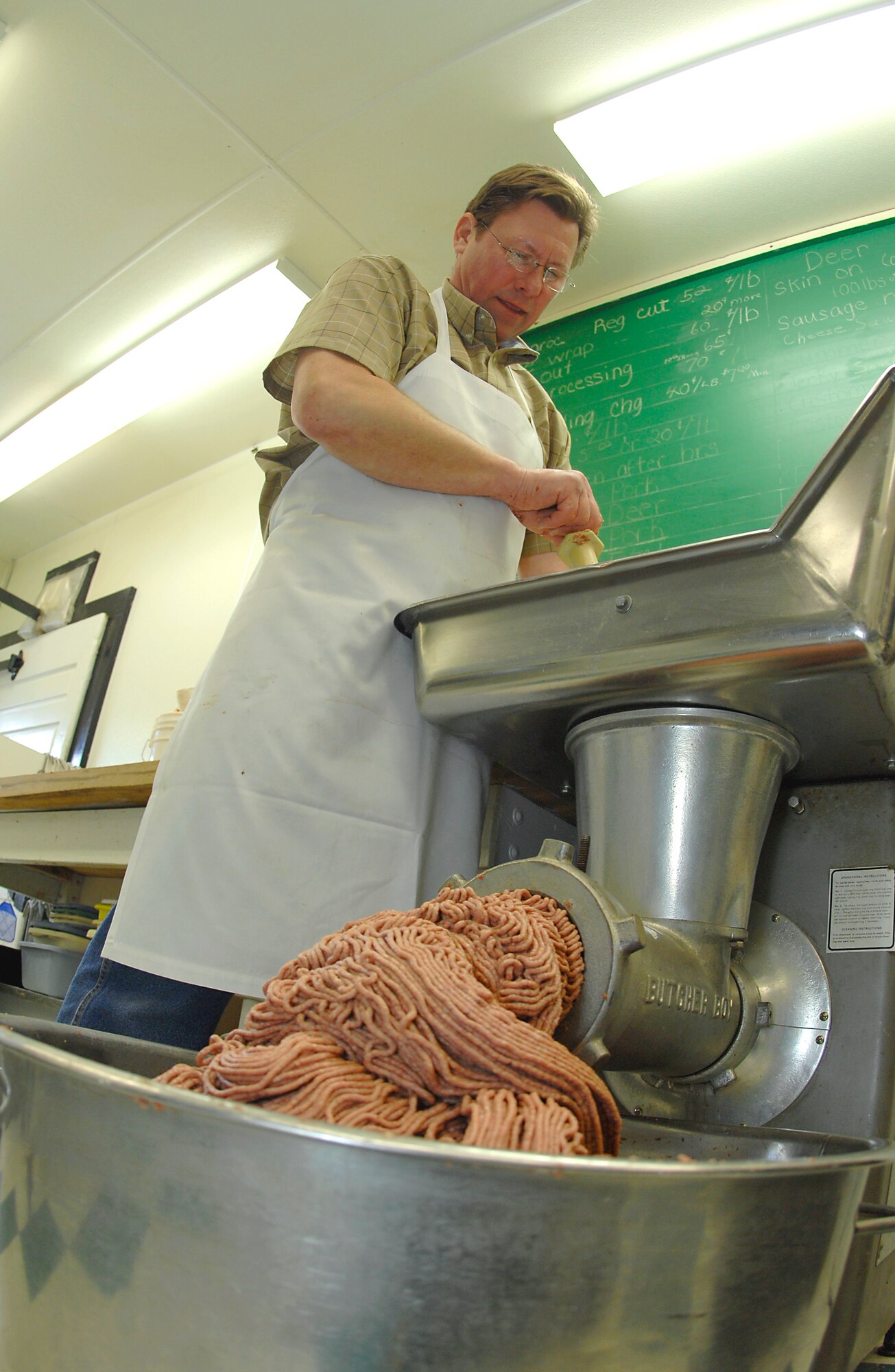 MINOT, N.D. -- Keith Blom, owner of Blom’s Meat Market, prepares sausage at Blom’s Meat Market here Jan. 16, for the upcoming 44th Annual Sportsmen Feed. The feed, which is an annual event designed to build fellowship between the base and local community, was held at the Jimmy Doolittle Center Jan. 18 at Minot AFB. (U.S. Air Force photo by Airman 1st Class Benjamin Stratton)