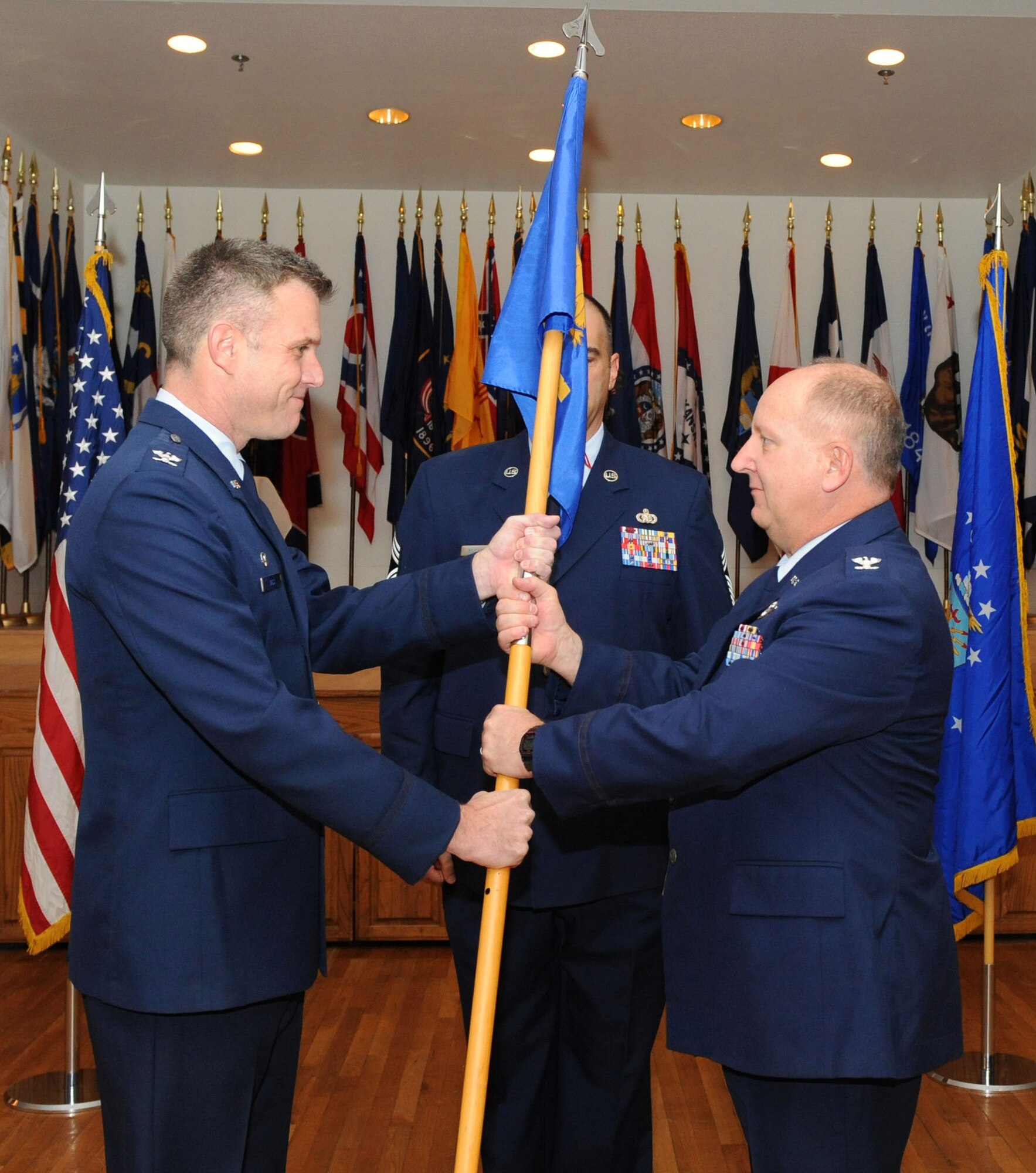 DYESS AIR FORCE BASE, Texas -- Colonel James Murray (right) assumes command of the 7th Mission Support Group from Colonel Robert Gass (left), 7th Bomb Wing Commander, here, Jan. 16.  The change of command ceremony is deeply rooted in history and tradition with the military.  (U.S. Air Force photo by Staff Sergeant Connor Estes).   