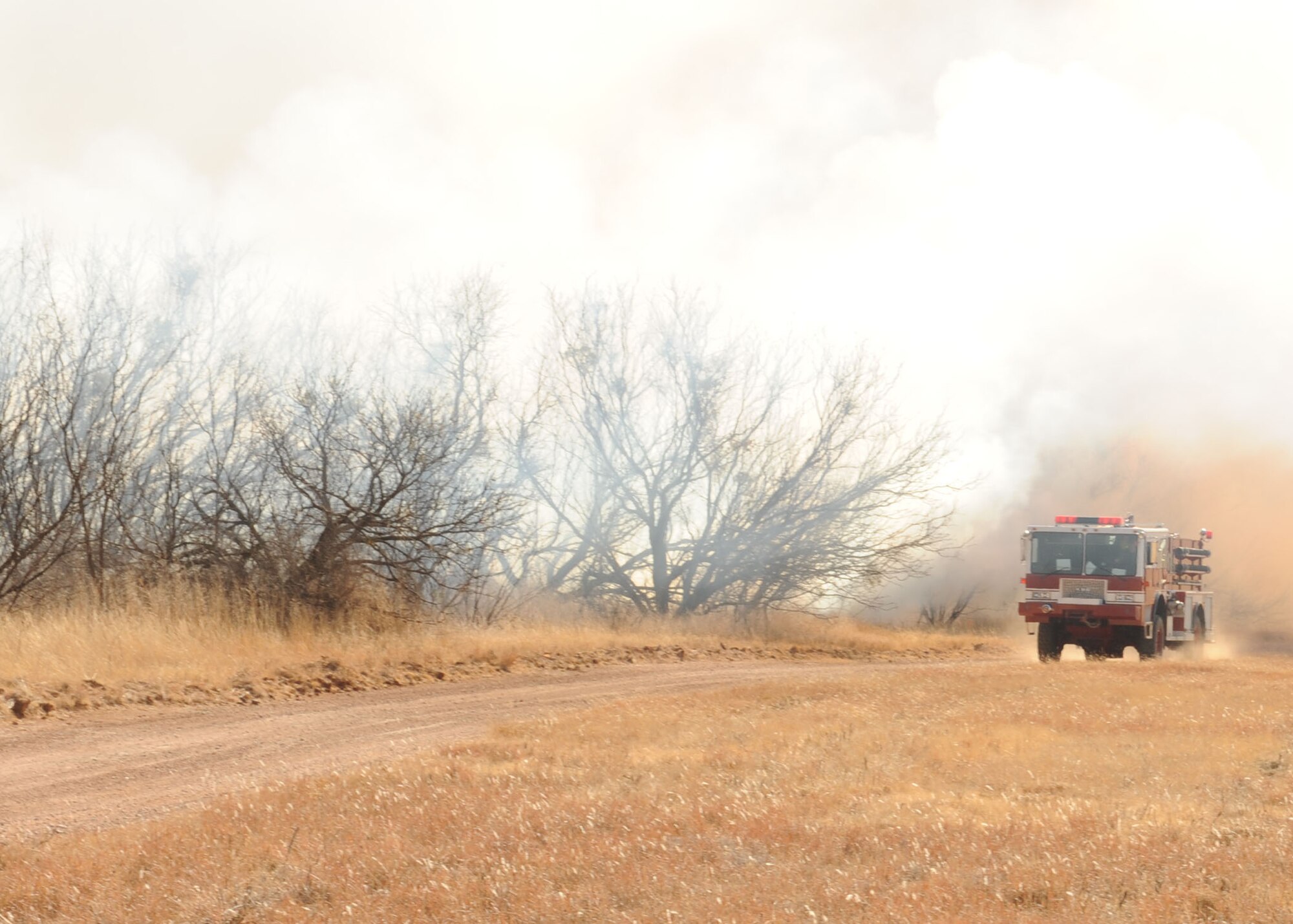DYESS AIR FORCE BASE, Texas -- Firefighters from the 7th Civil Engineering Squadron proceed in route to the secondary burn site during a controlled burn here, Jan. 15.  Controlled burns are performed in order to help prevent wild fires throughout base.(U.S. Air Force photo by Senior Airman Felicia Juenke)