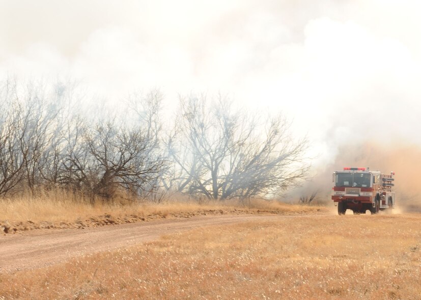 DYESS AIR FORCE BASE, Texas -- Firefighters from the 7th Civil Engineering Squadron proceed in route to the secondary burn site during a controlled burn here, Jan. 15.  Controlled burns are performed in order to help prevent wild fires throughout base.(U.S. Air Force photo by Senior Airman Felicia Juenke)