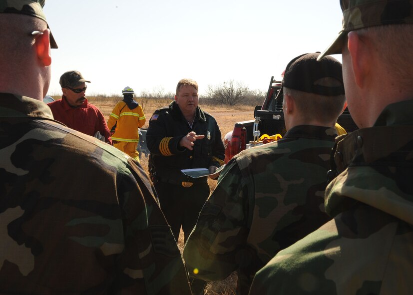 DYESS AIR FORCE BASE, Texas -- Floyd Jones, from the 7th Civil Engineering Squadron, ensures all firefighters participating in the controlled burn are briefed on what to expect and what to do in an emergency here, Jan. 15. It's imperative that the firefighters are able to respond to any fire on base within three minutes. (U.S. Air Force photo by Senior Airman Felicia Juenke)