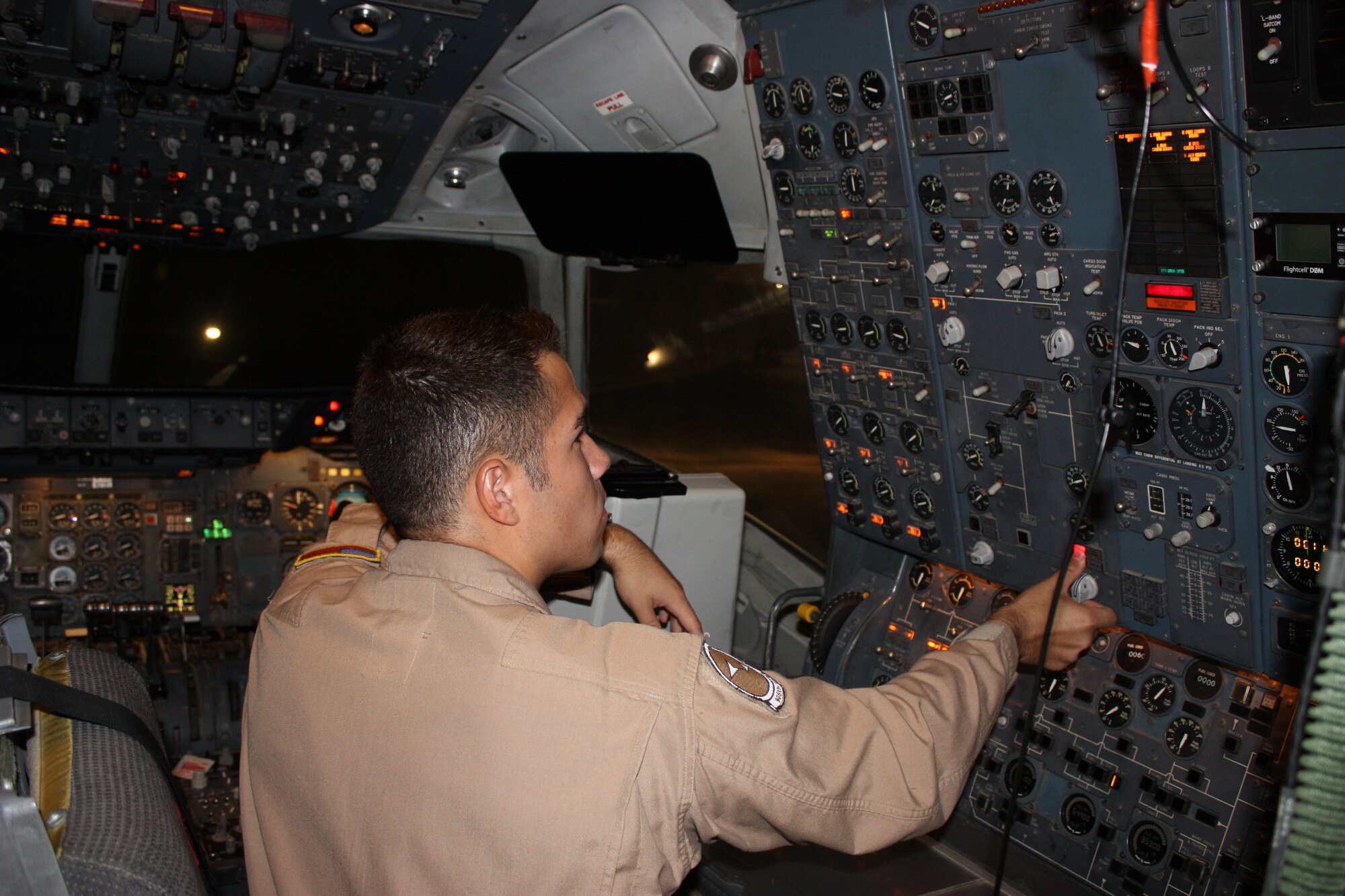 Staff Sgt. Luis Merino, 2nd Air Refueling Squadron KC-10 flight engineer, runs pre-flight checks prior to a mission while deployed in 2008. The 2nd ARS has maintained a continuous presence in the Middle East since 1991, providing fuel to aircraft in support of the Global War on Terrorism. (U.S. Air Force courtesy photo) 