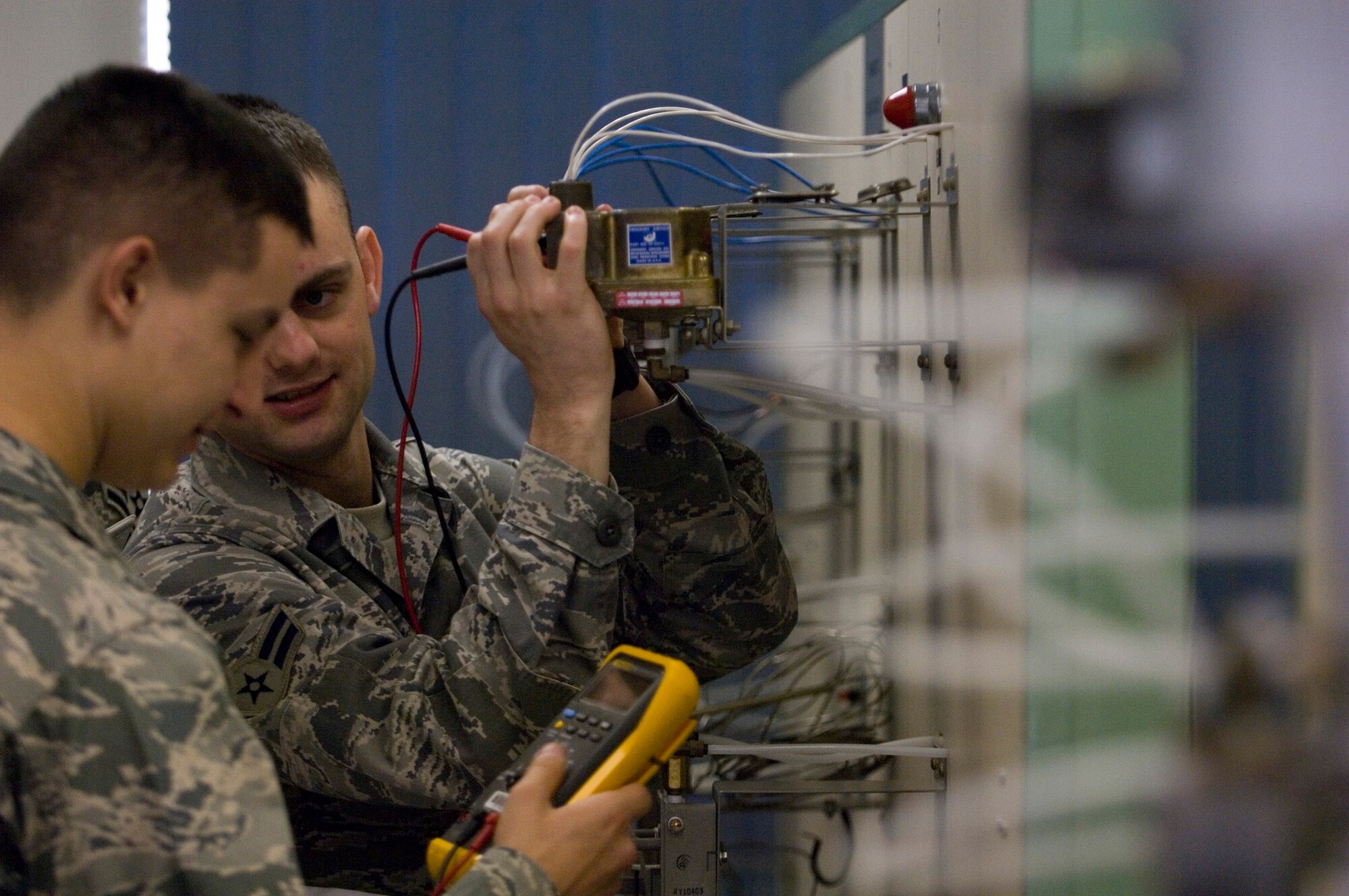 VANDENBERG AIR FORCE BASE, Calif. -- Airmen 1st Clas Michael Fuerte, left, and David Reynolds, both technical school students at the 532nd Training Squadron here, conduct hands-on training for the environmental control system of a missile launch facility. Missile maintenance technical training now takes place entirely at Vandenberg since the school house integrated electronic principles training Jan. 5. (U.S. Air Force photo/Staff Sgt. Vanessa Valentine)
