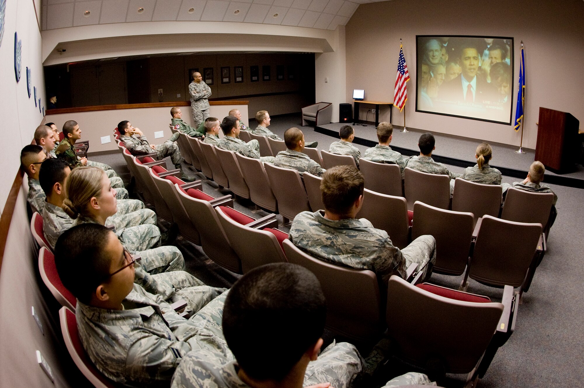 McChord Airman gather in the First Term Airmen Center conference room here Jan. 20 to hear President Barack Obama deliver his inaugural address from Washington, D.C. (U.S. Air Force photo/Abner Guzman)