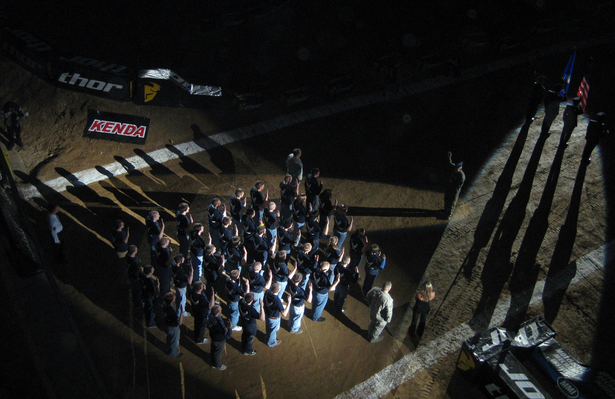 Lt. Col. Kent Dalton administers the oath of enlistment to 35 young men and women Jan. 17 before a crowd of more than 10,000 fans at the opening ceremonies of the Dayton Arena Cross. Colonel Dalton is the commander of the 338th Recruiting Squadron. (U.S. Air Force photo/Tech. Sgt. Libby Stevenson)