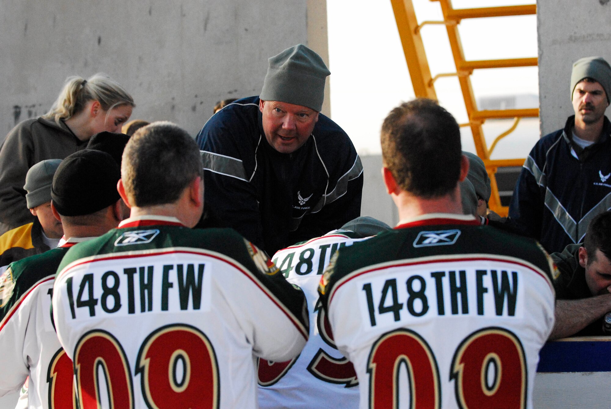 Head coach of the 148 Fighter Wing "Bulldogs," Master Sgt. John Keller of Coon Rapids, MN, coaches his team to victory during the Jan. 17 Minnesota Hockey Day in Iraq game. The ?Bulldogs? defeated the 834 Aviation Support Battalion "Skaters? with a score of 4-2. This game was held in conjunction with Fox Sports Net North's Minnesota Hockey Day coverage. The 834 ASB and the 148 FW are Minnesota National Guard units currently deployed to Joint Base Balad, Iraq in support of Operation Iraqi Freedom.