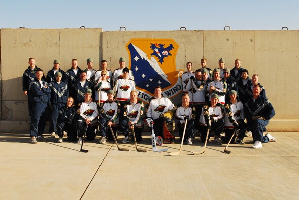 Minnesota National Guardsmen from the 148th Fighter Wing come together to play a game of floor hockey on Joint Base Balad, Iraq on Jan. 16.