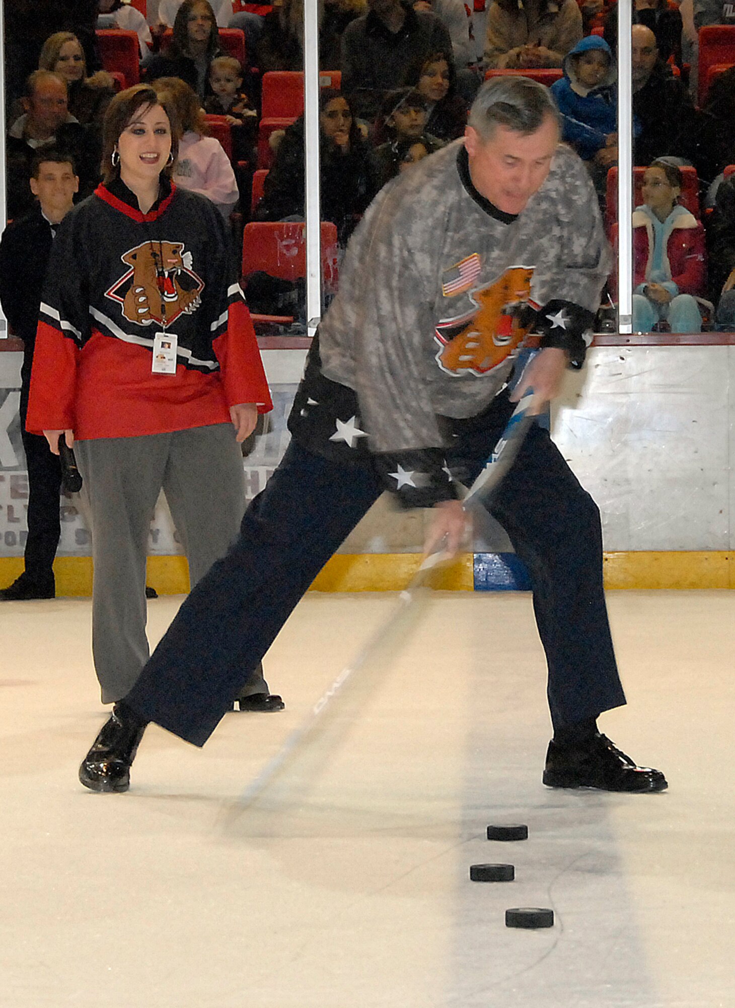 Brig. Gen. O.G. Mannon, 82nd Training Wing commander, tries his hand at making a goal from center ice Jan. 17 during the Wichita Falls Wildcats annual Military Appreciation Night. The general nailed the first shot, winning a free coupon to Whataburger for everyone in attendance. (U.S. Air Force photo/Mike Litteken)