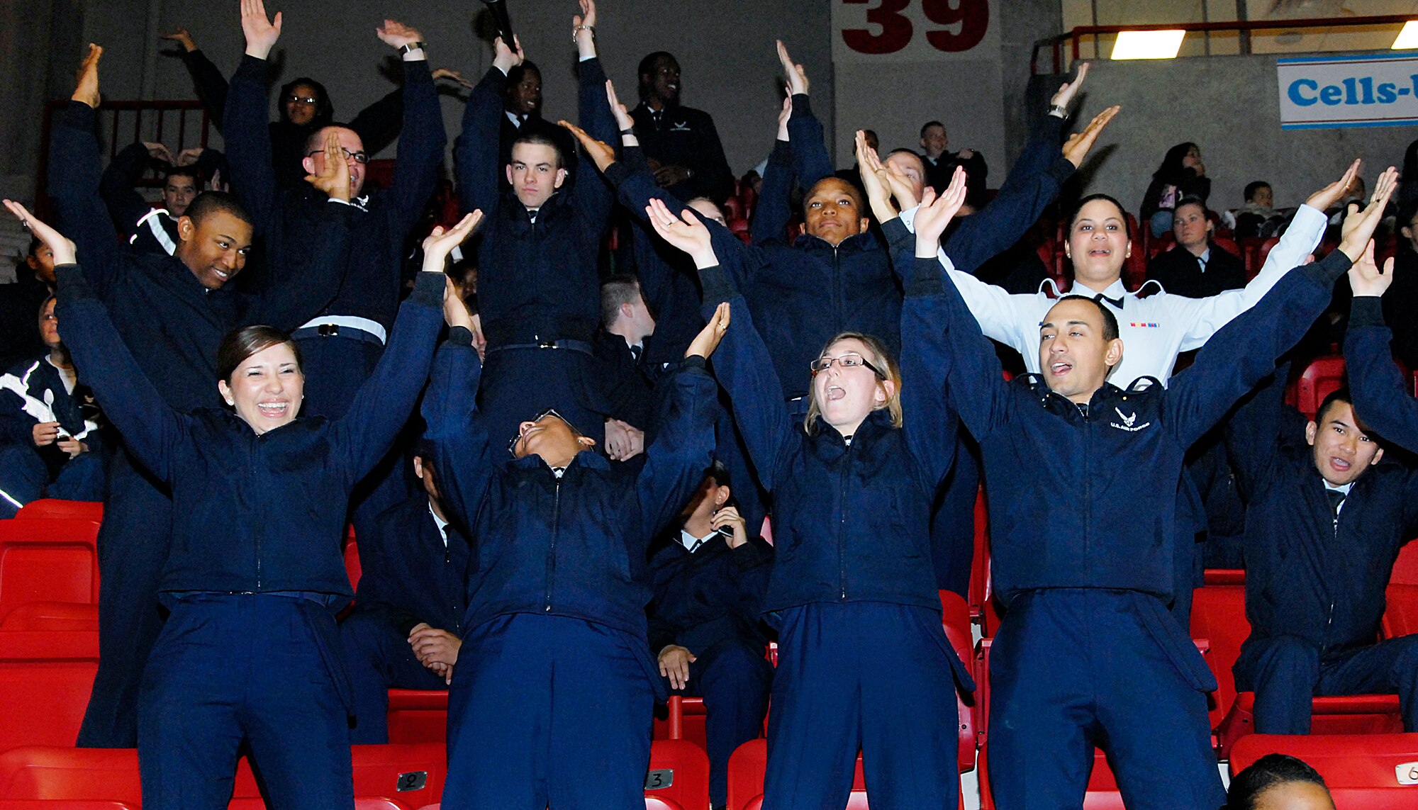Airmen in Training from Sheppard Air Force Base get into the excitement Jan. 17 at the annual Wichita Falls Wildcats Military Appreciation Night. Permanent party, AiT and Defense Department civilians attended the event. (U.S. Air Force photo/Mike Litteken)